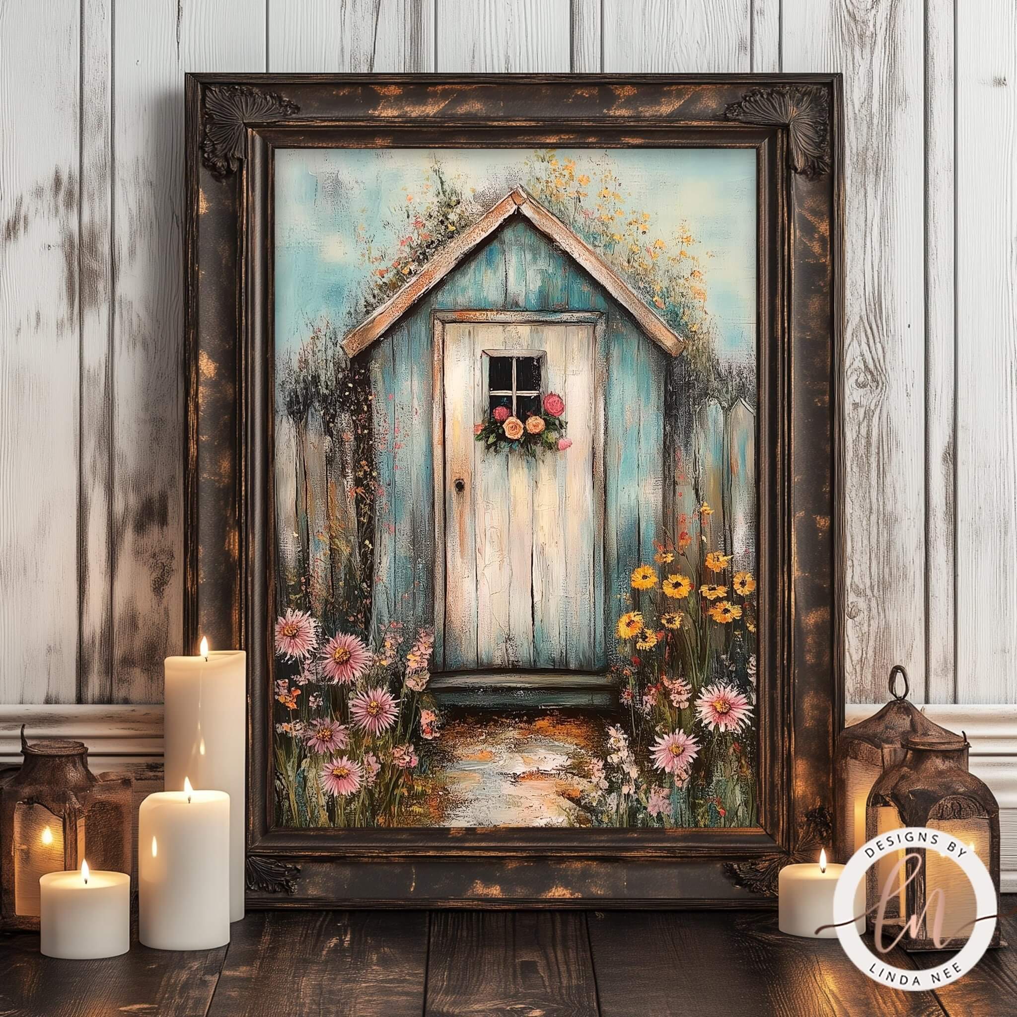 a painting of a quaint blue wooden shed with a flower-adorned door, surrounded by a vibrant garden scene with pink and yellow flowers. The painting is displayed in a rustic wooden frame, and there are lit candles and lanterns in the foreground, creating a warm and inviting atmosphere.