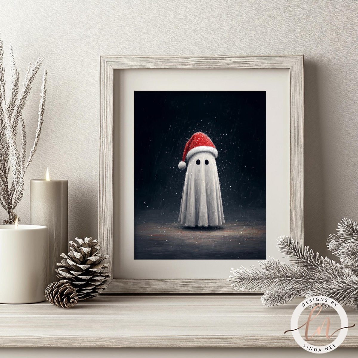 a framed artwork depicting a ghost wearing a Santa hat, placed on a shelf next to a pine cone and a candle.