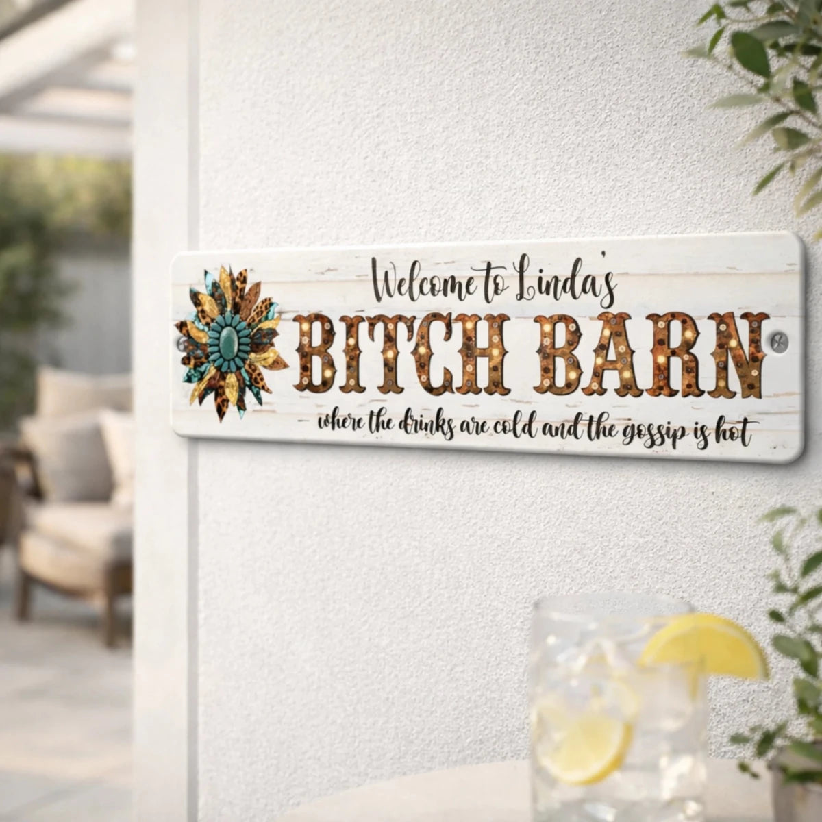 A sign that says "Welcome to Linda's Bitch Barn" with a decorative flower design.