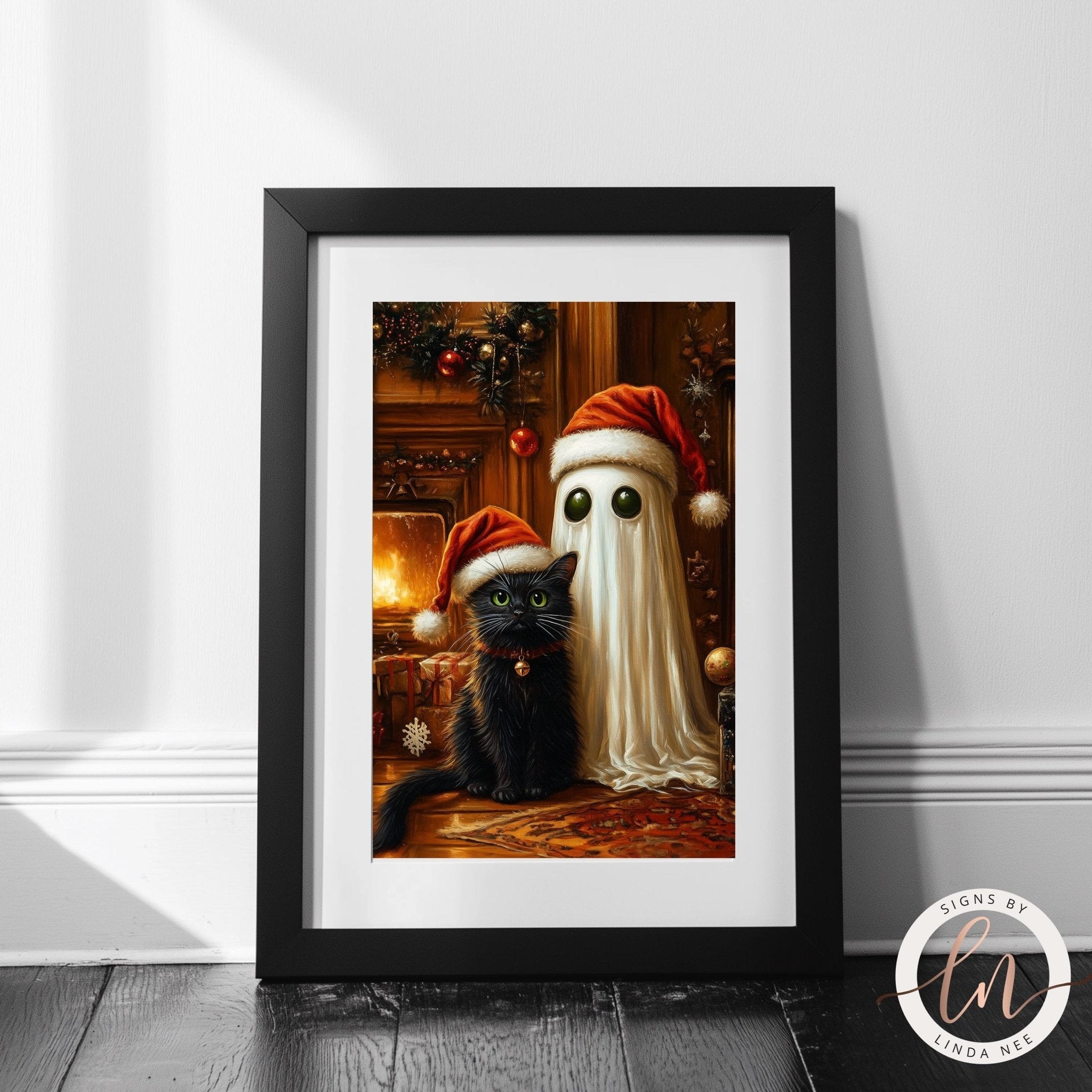 A framed print depicting a black cat sitting next to a ghost wearing a Santa hat, with a fireplace and Christmas decorations in the background.