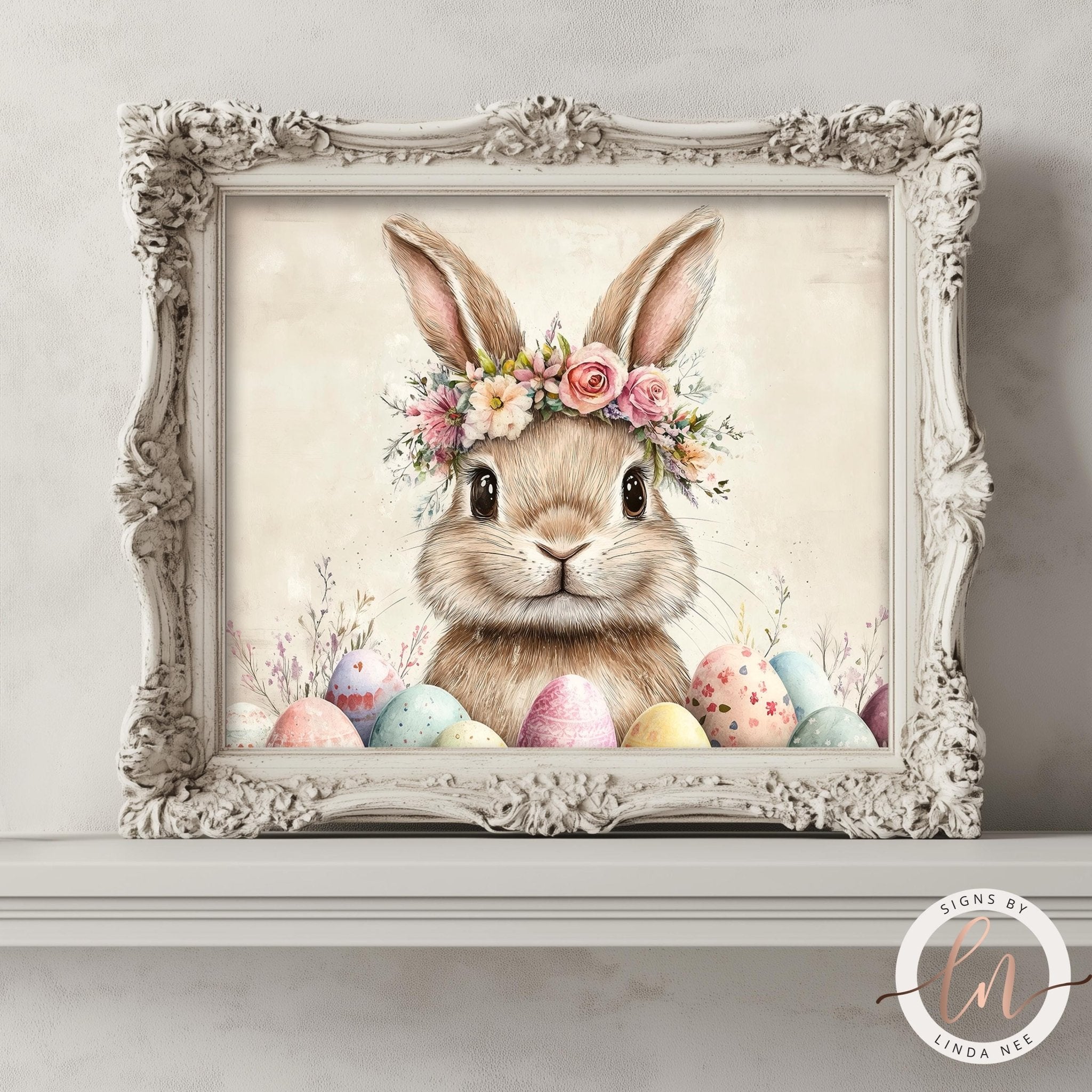 A framed illustration of a bunny wearing a flower crown, surrounded by colorful Easter eggs.
