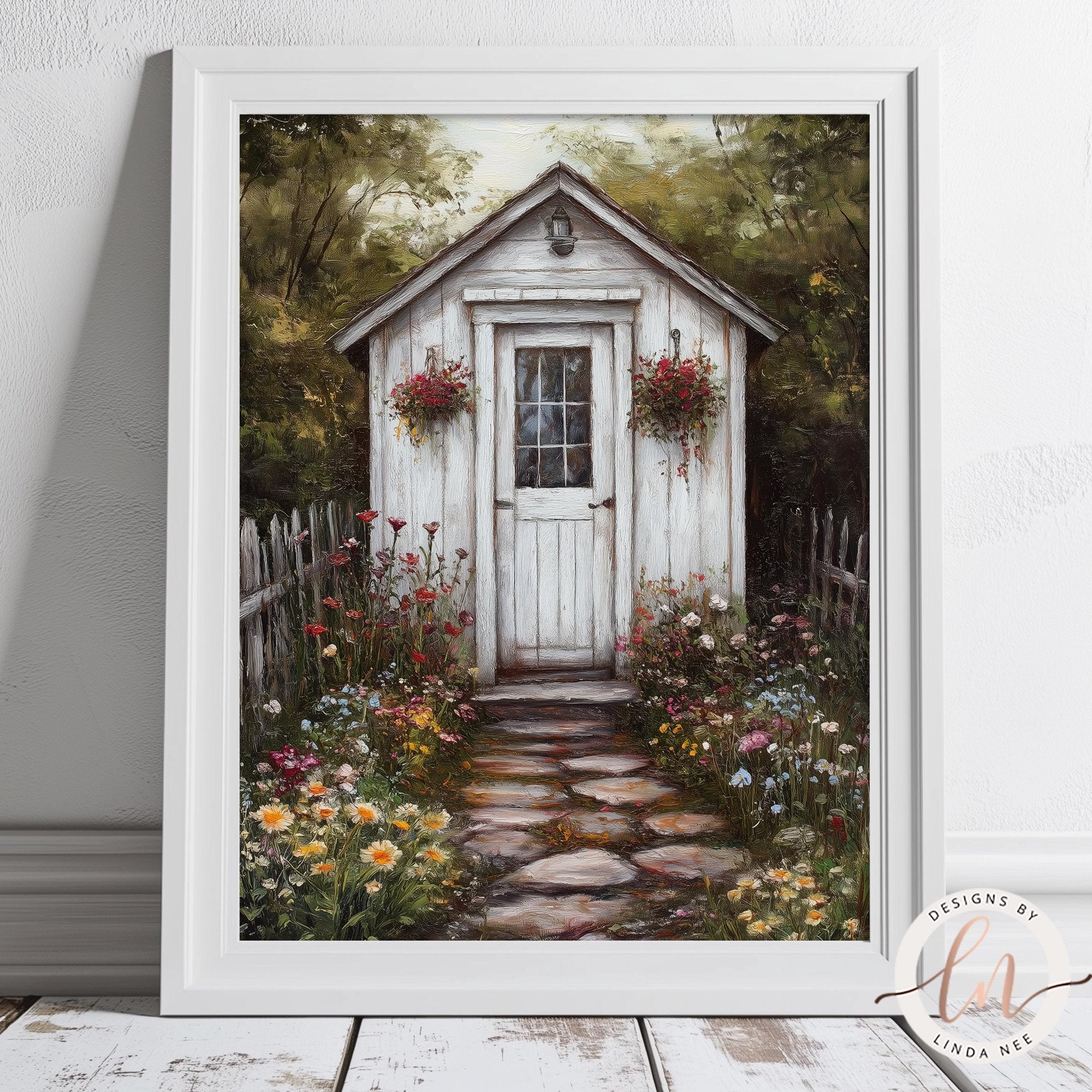 A white wooden shed with a flower-filled window and door, surrounded by a stone path and a lush garden filled with colorful flowers.