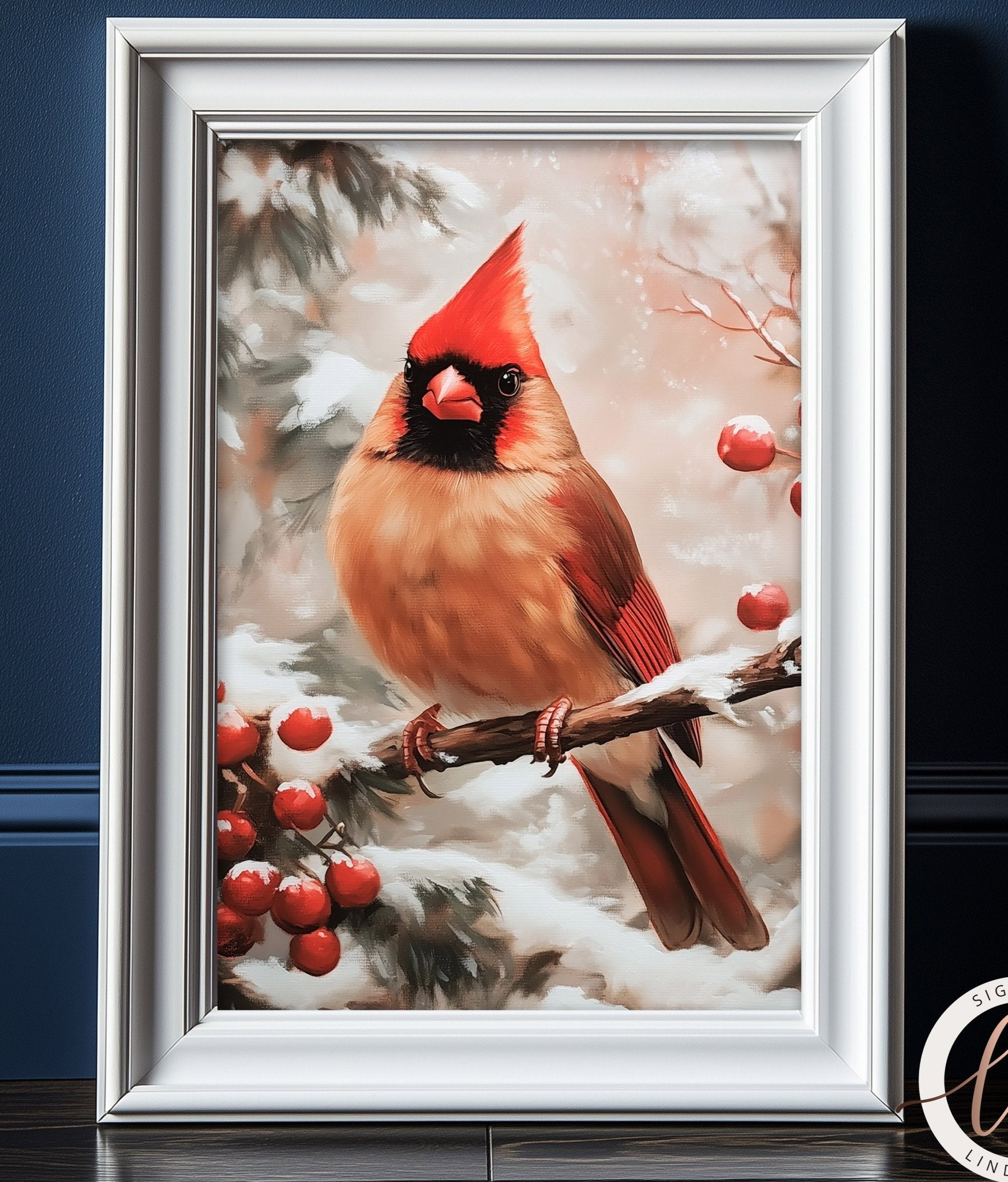 A framed image of a red cardinal bird perched on a branch with red berries, set against a snowy background.