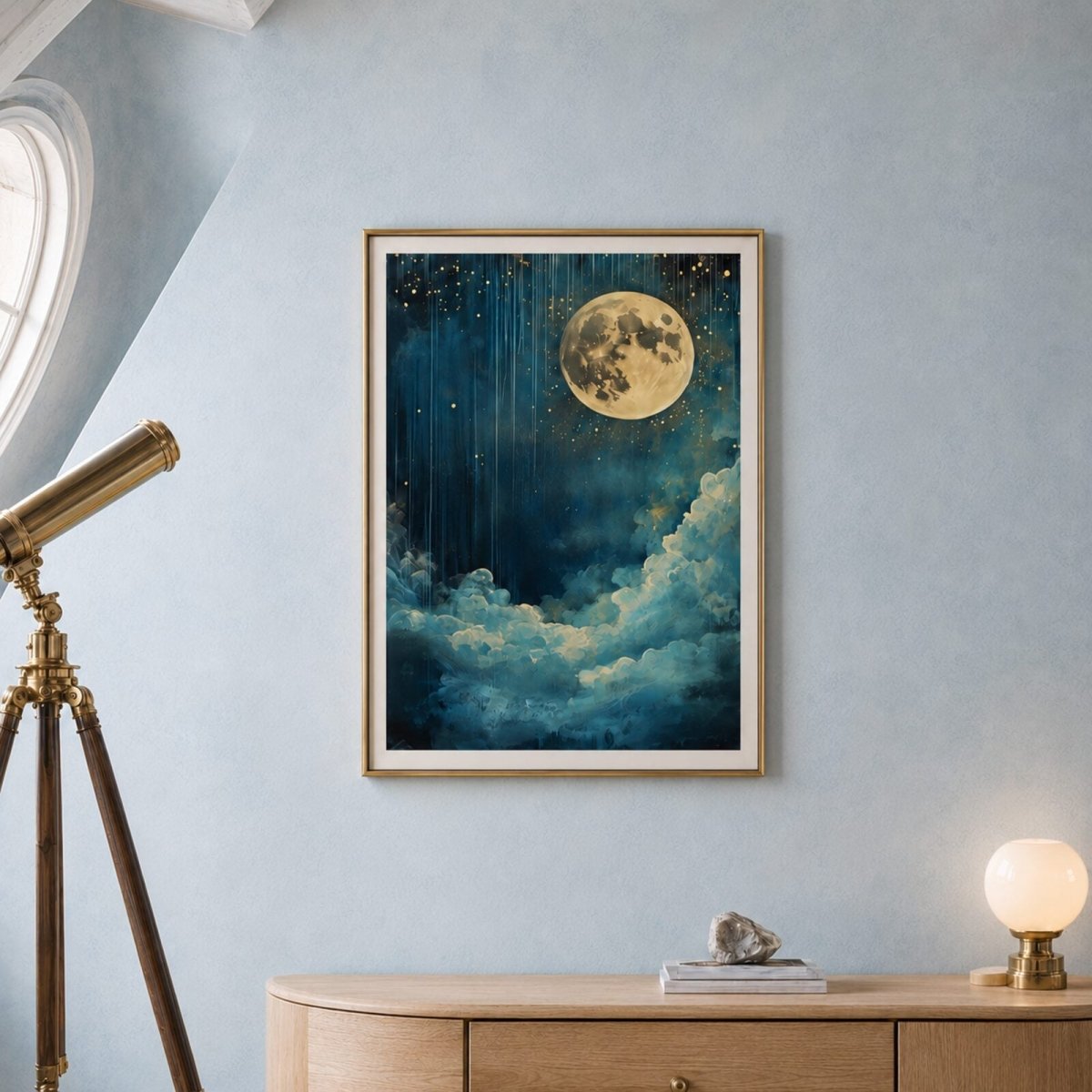 Framed moon and stars art print displayed in a bright observatory-inspired room with a brass telescope and light wood console.