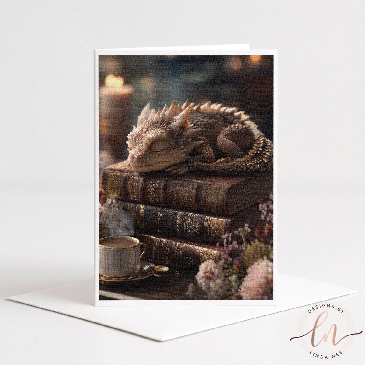 A sleeping dragon rests on a stack of books, surrounded by flowers and a cup of tea, creating a cozy and whimsical scene.