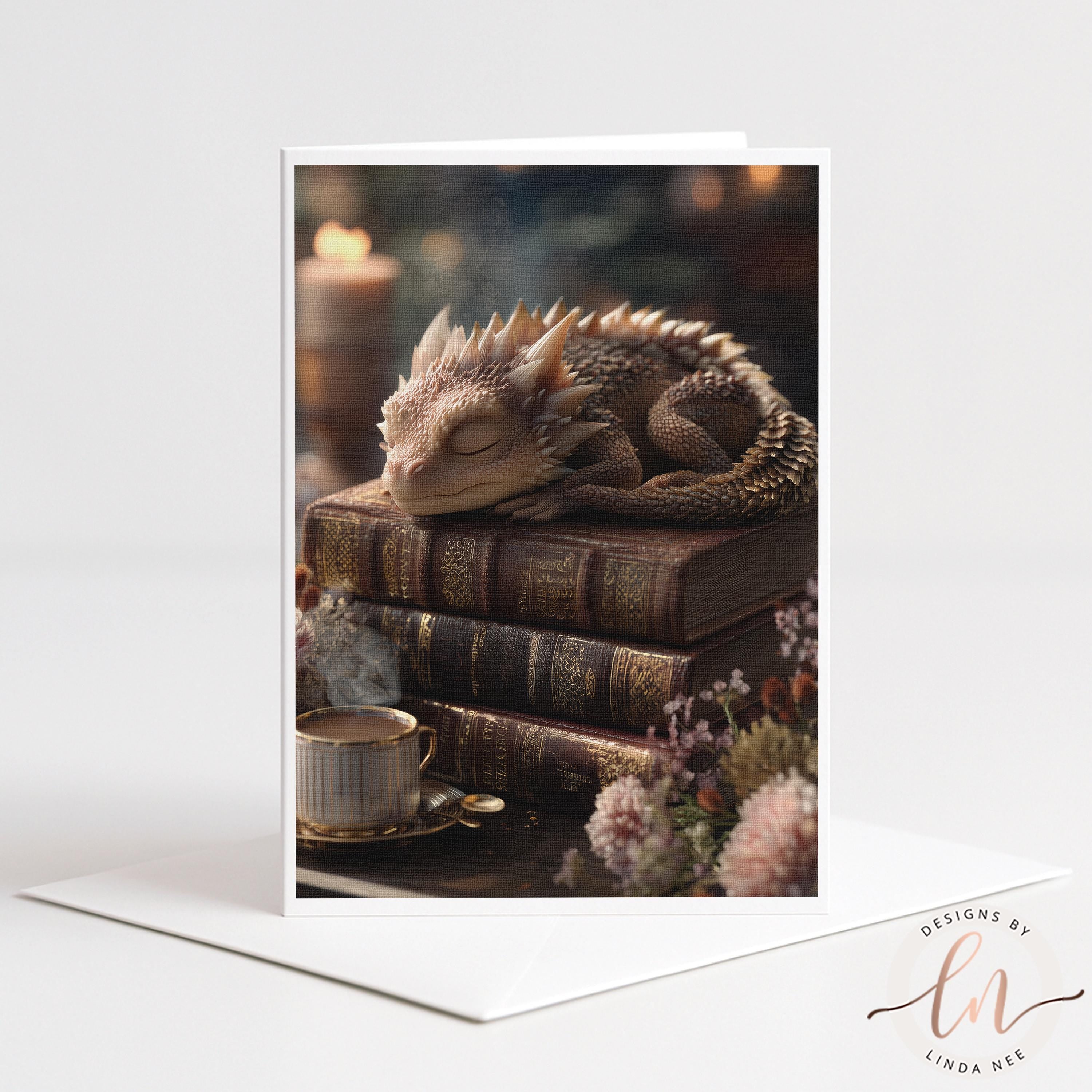A sleeping dragon rests on a stack of books, surrounded by flowers and a cup of tea, creating a cozy and whimsical scene.