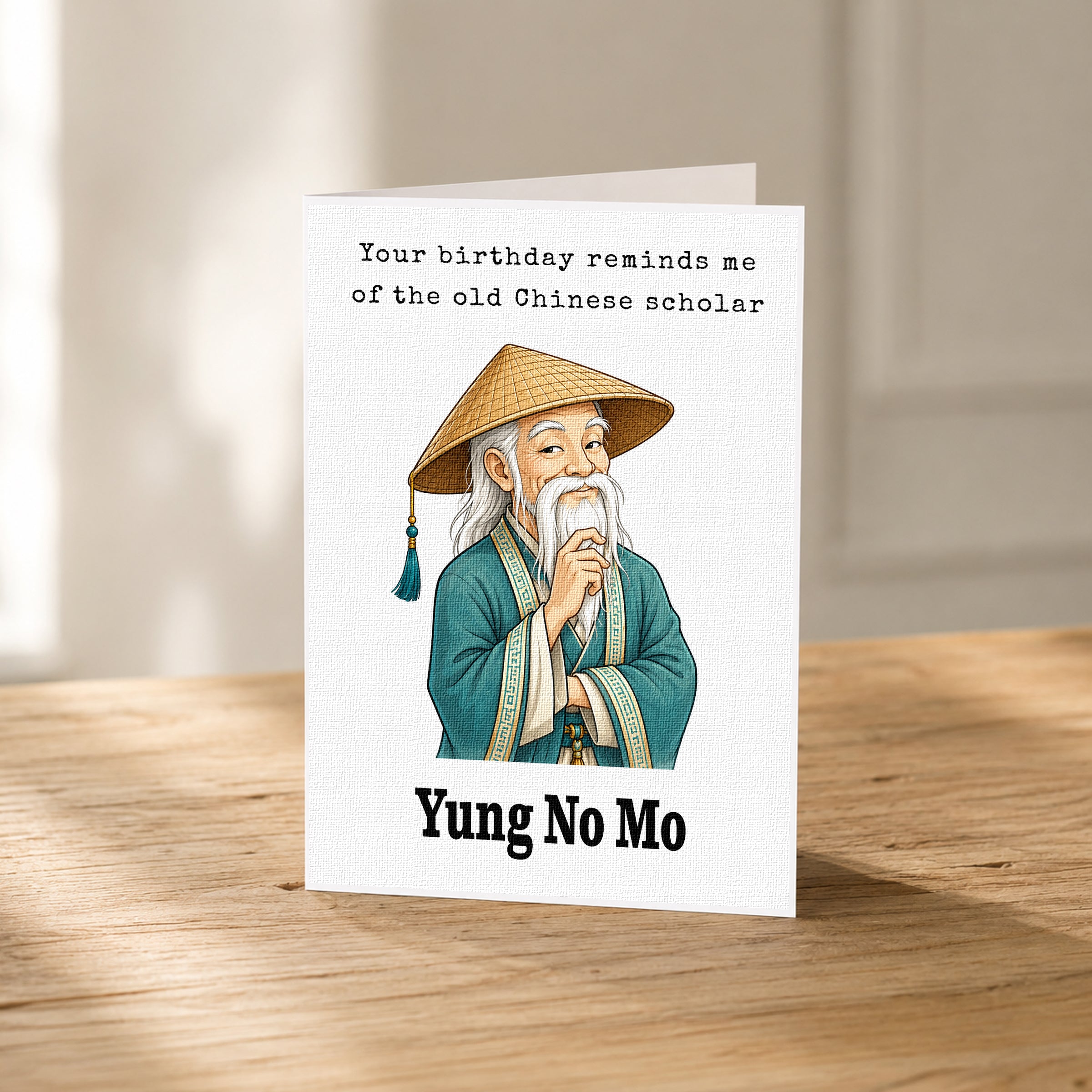 A birthday card featuring an illustration of an elderly man with a long white beard wearing a traditional Chinese conical hat, sitting on a wooden surface.