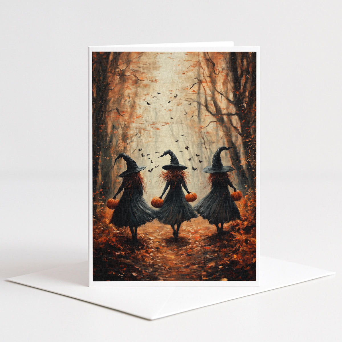 Three witches carrying pumpkins through an autumn forest with bats, 5x7 note card