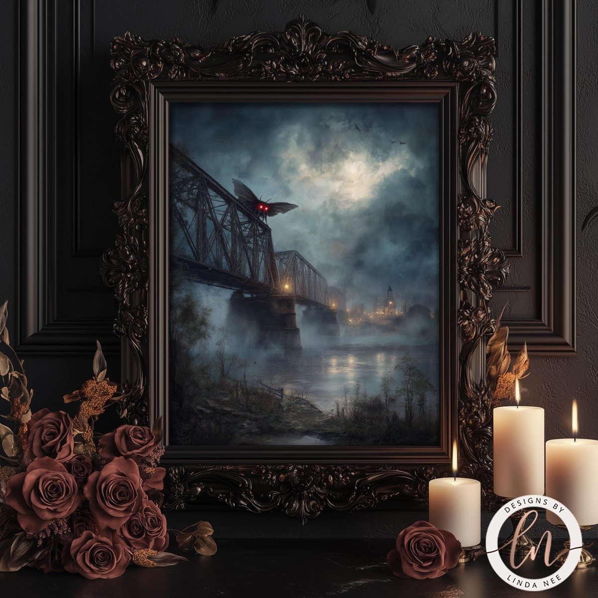 a dark, moody scene with a bridge, mist, and a Mothman. The scene is framed in an ornate, dark frame, and there are candles and roses on a table in front of the frame.