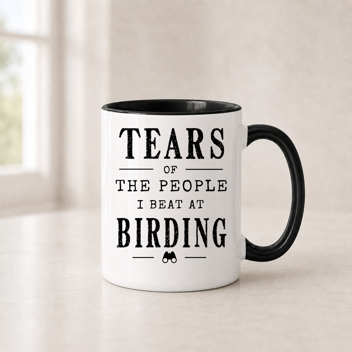 Tears of the People I Beat at Birding mug in the 11 oz black handle version with a black interior