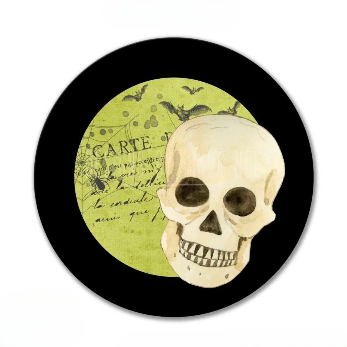 A skull is depicted in the center of a circular frame, with bats flying around it and the word "CARTE" written on the frame.
