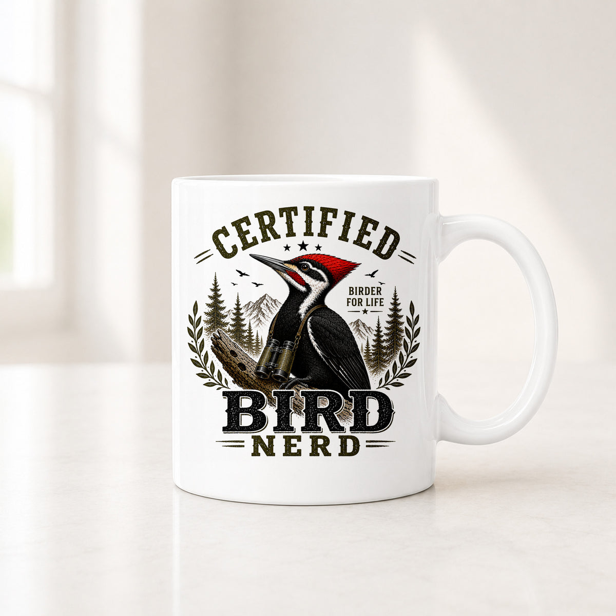 Second view of the white pileated woodpecker mug showing the red crest inside a laurel wreath badge