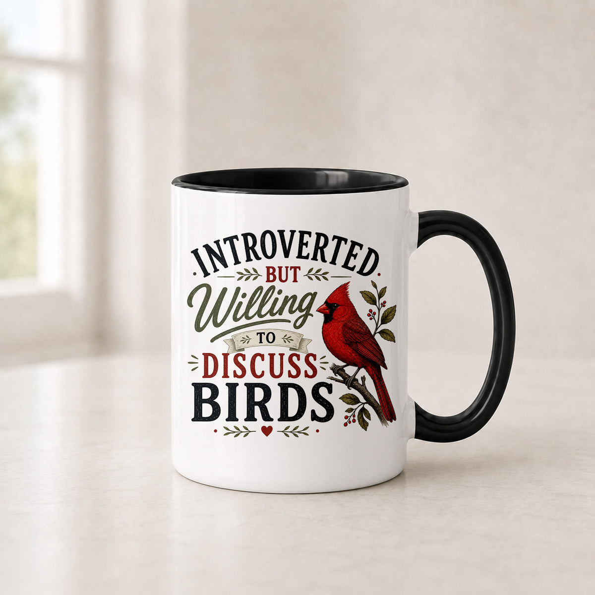 Introverted cardinal mug in the 11 oz black handle version with a black interior, on a light counter
