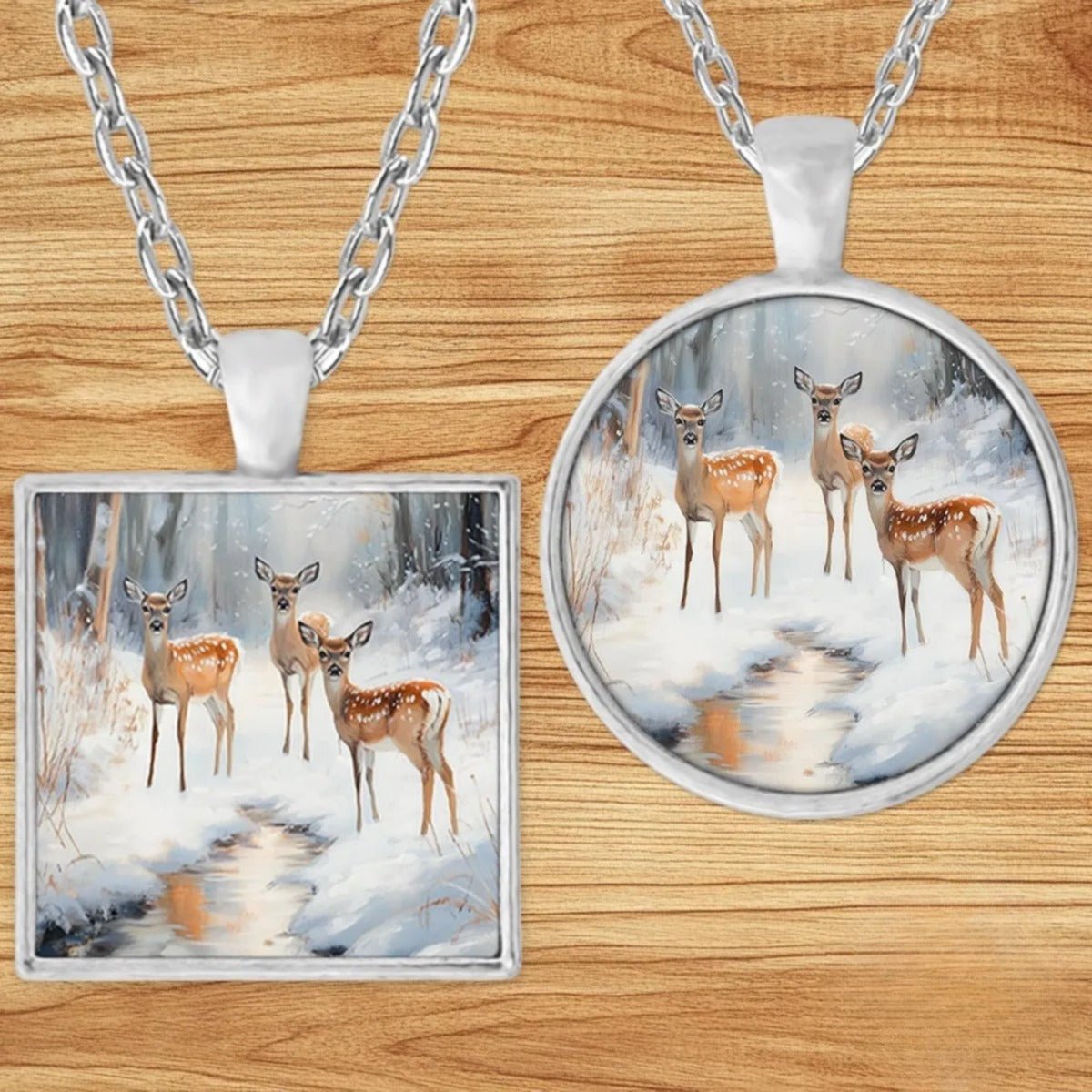 Three Fawns Winter Stream pendant necklace shown in round and square silver charm styles on a wood background