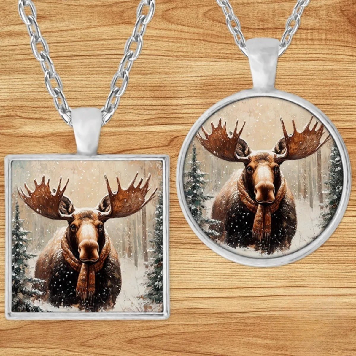 Moose in a Plaid Scarf pendant necklace shown in round and square silver charm styles on a wood background
