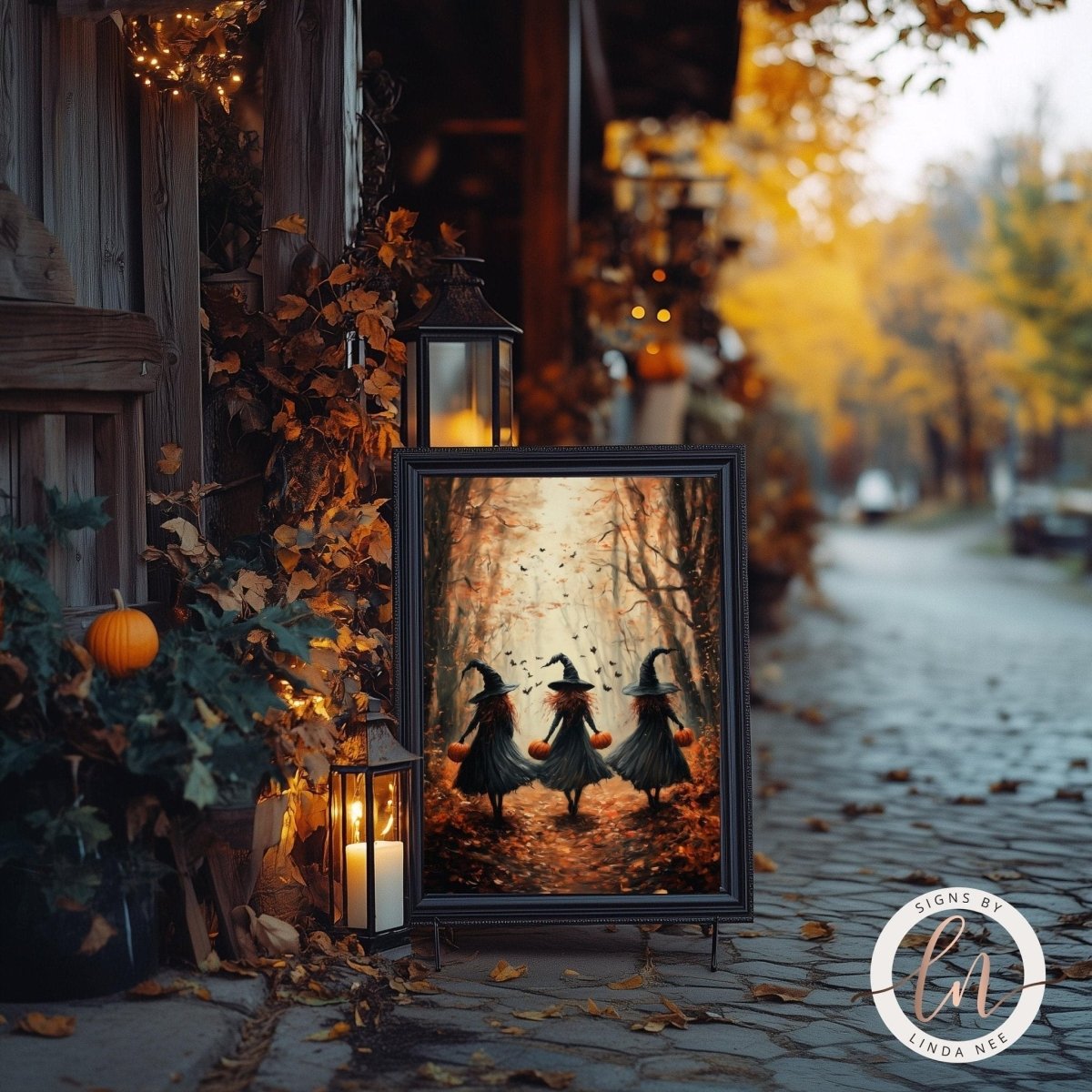 Three witches in the forest artwork with lit lanterns and fall foliage