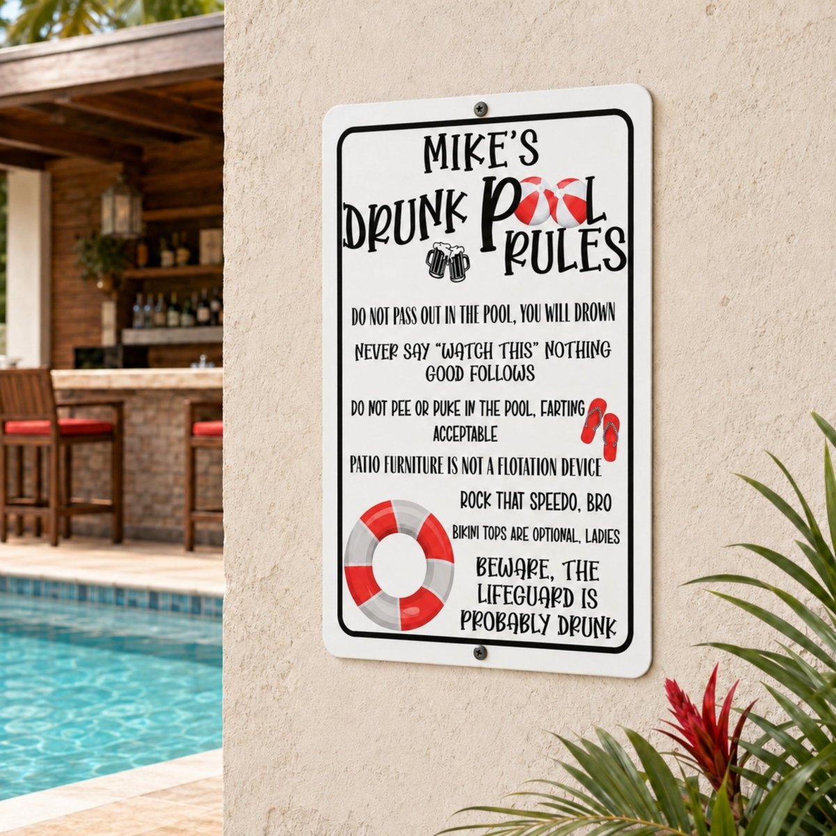 a sign with rules for a pool area, mounted on a wall next to a pool and patio furniture.