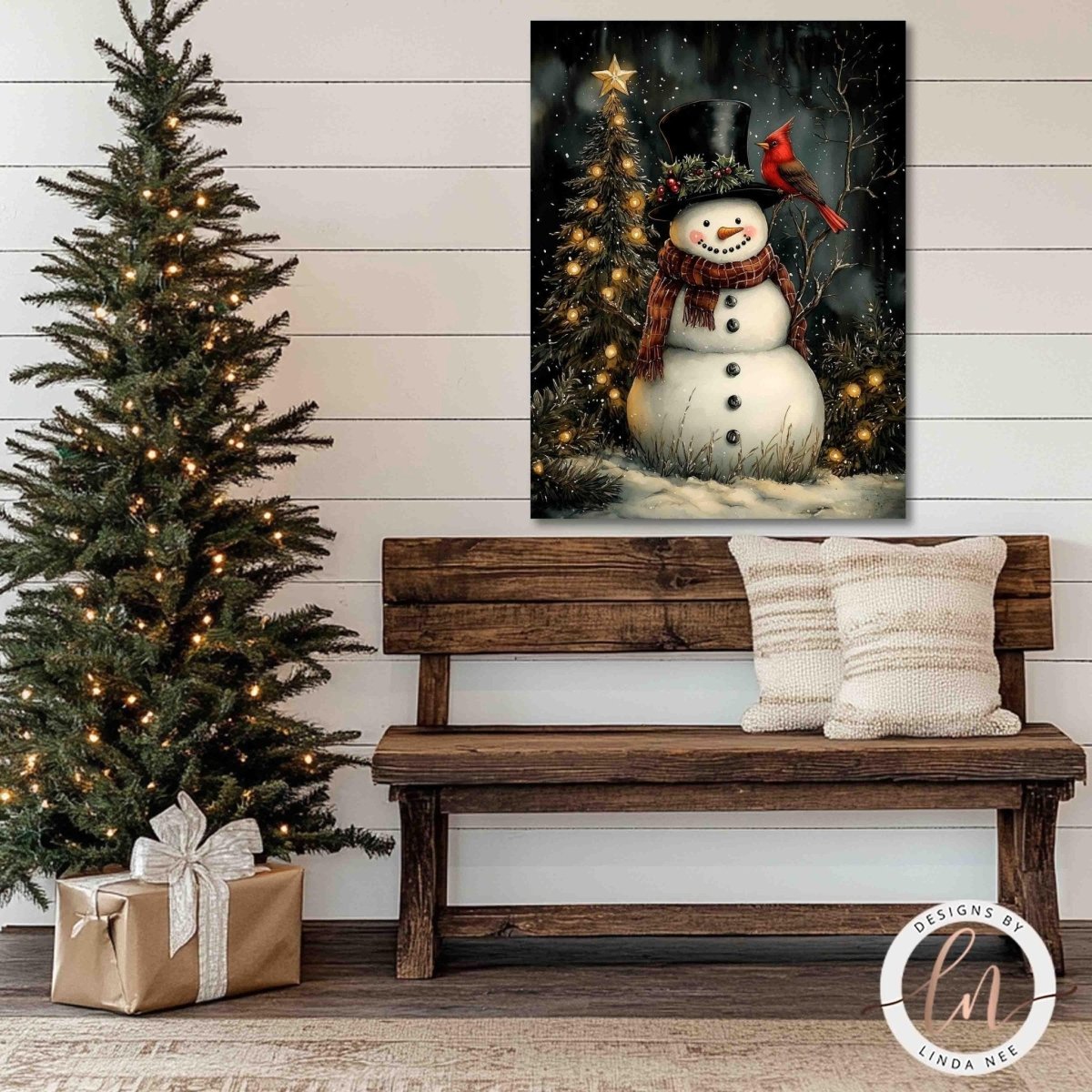 Snowman and cardinal wall art above a wooden bench with pillows