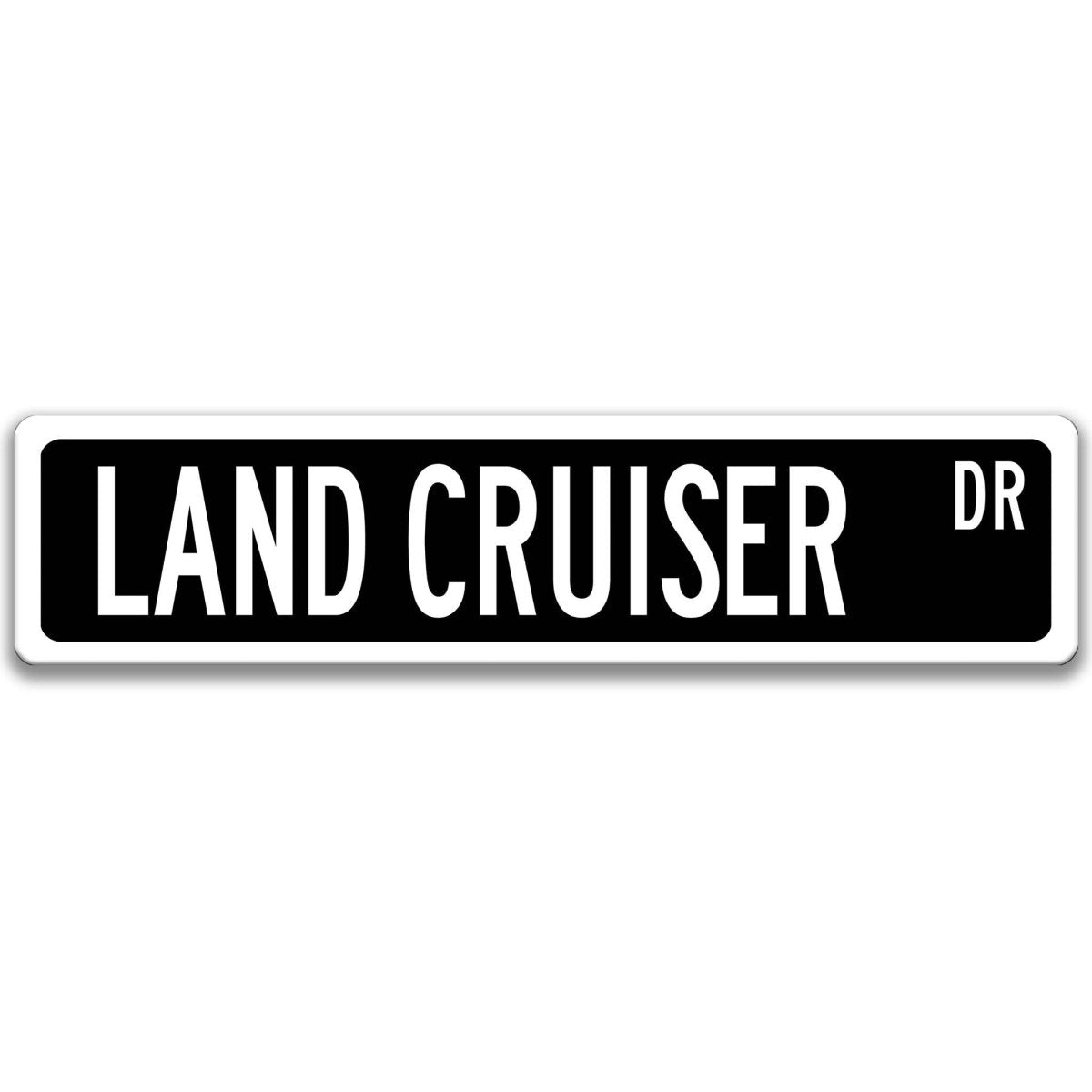 Black street sign with white border, white text reading LAND CRUISER DR