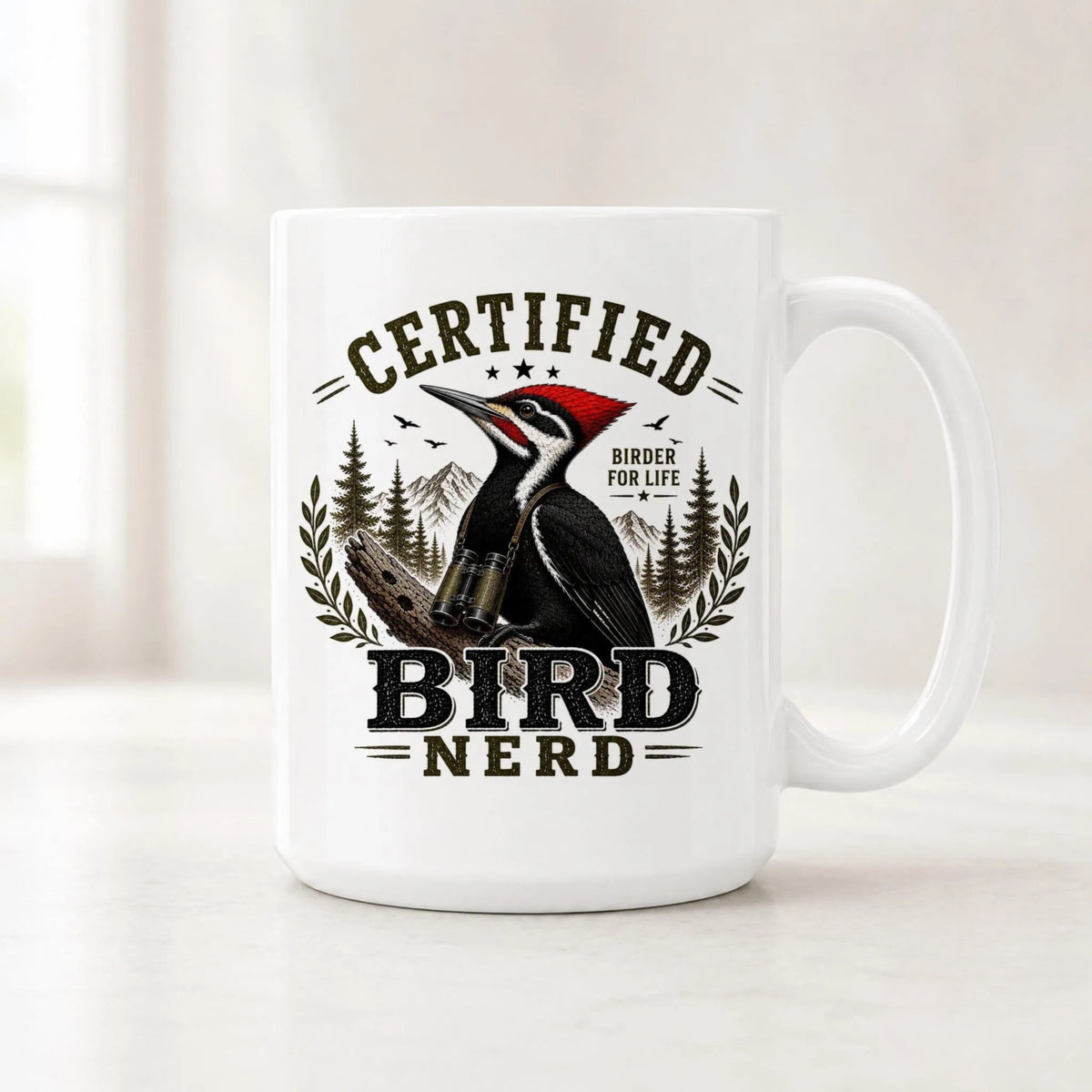 White Certified Bird Nerd mug with a pileated woodpecker in binoculars, pines and Birder for Life text