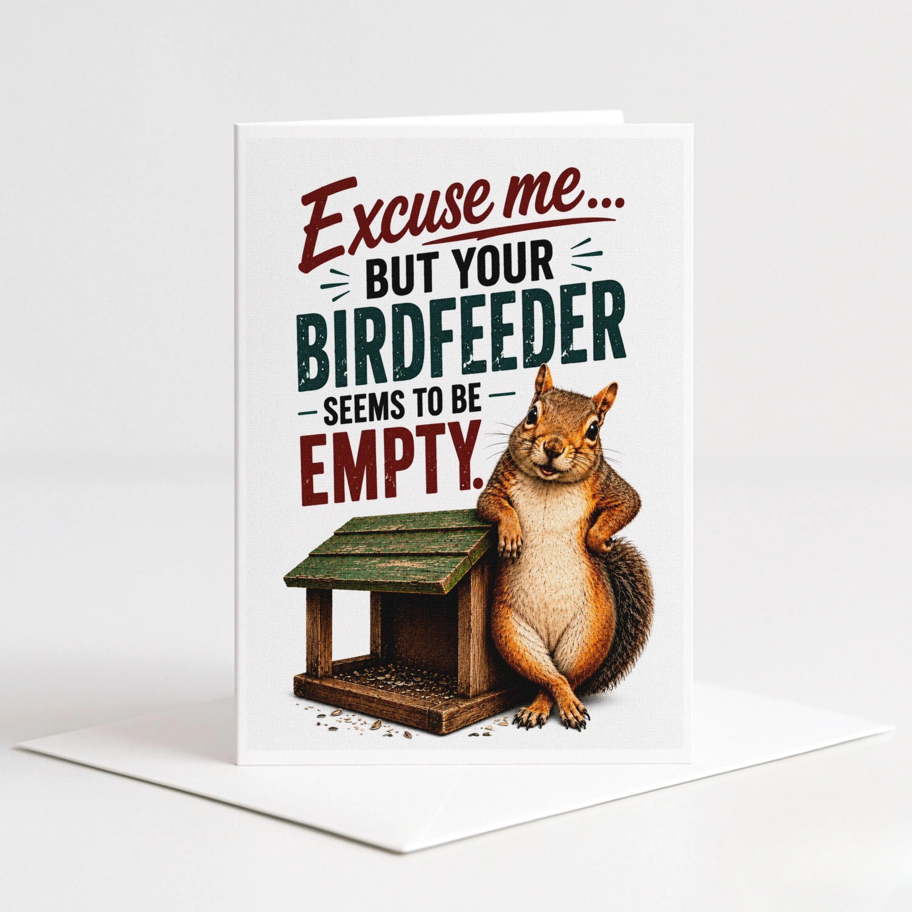 A greeting card with a cartoon squirrel sitting on a bird feeder and the text "Excise me... BUT YOUR BIRDFEEDER SEEMS TO BE EMPTY."