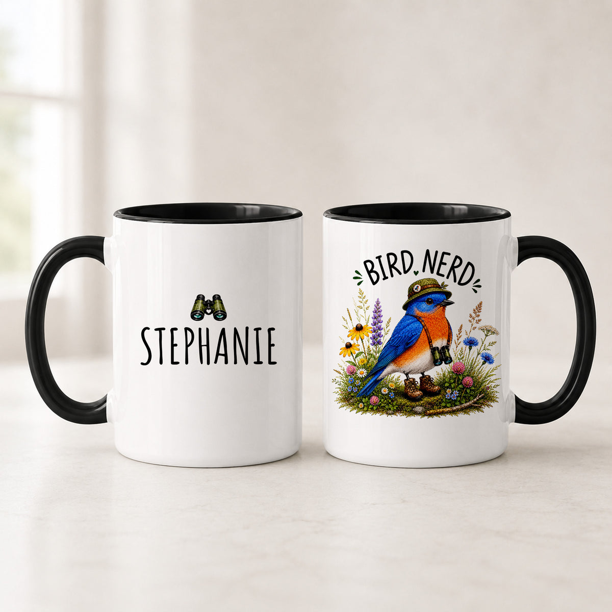 Black handle Eastern Bluebird Bird Nerd mugs showing the name STEPHANIE under binoculars and the field-dressed bird