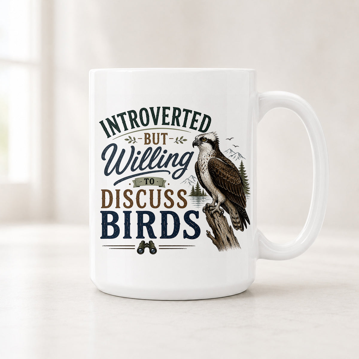 15 oz Introverted But Willing to Discuss Birds mug with an osprey perched on a snag above a pine-lined lake
