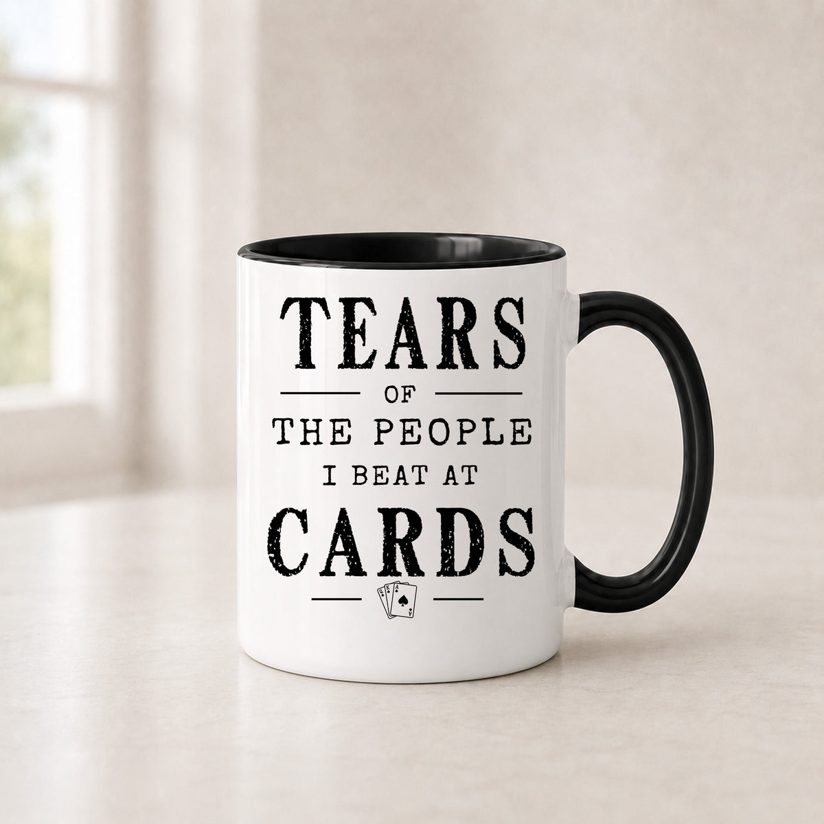 Tears of the People I Beat at Cards mug in the 11 oz black handle version with a black interior