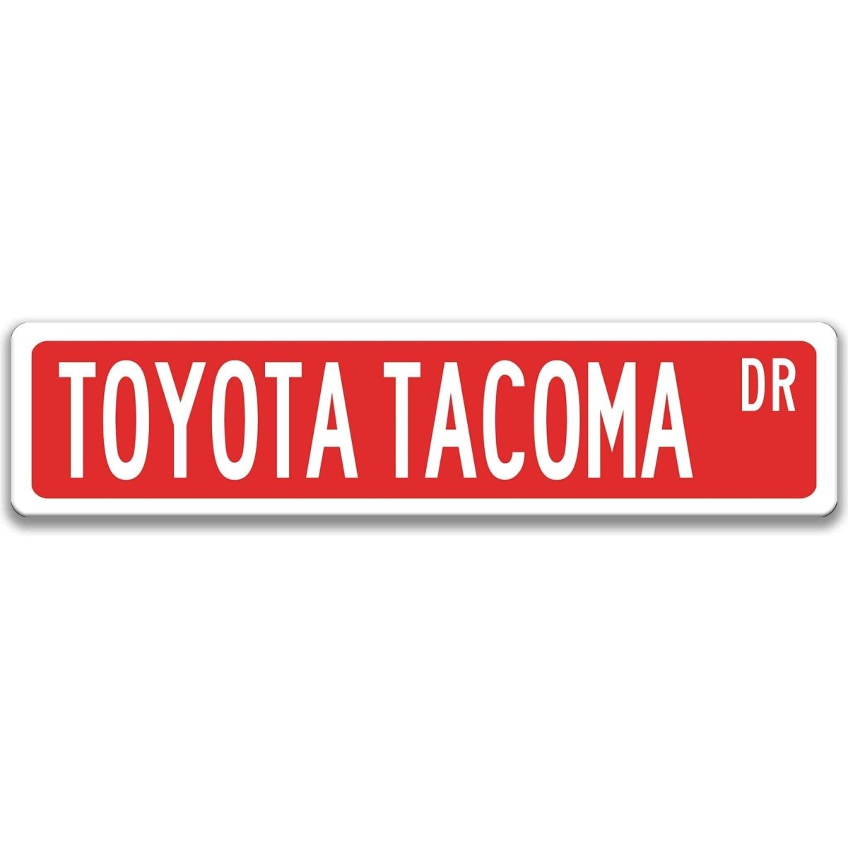 Red street sign with white border, white text reading TOYOTA TACOMA DR