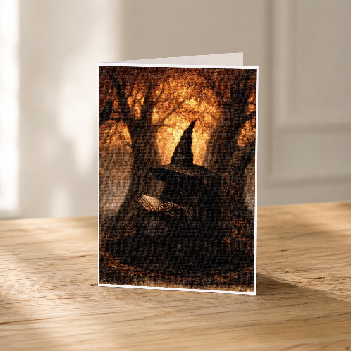 Witch reading with her cat beside her under autumn trees, 5x7 blank note card by Linda Nee