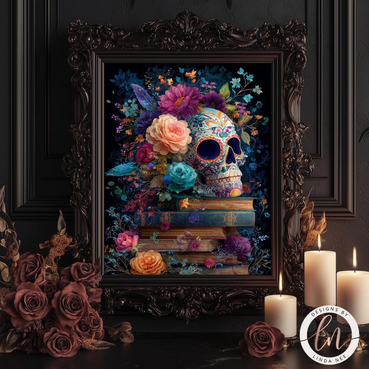 a framed artwork depicting a colorful skull surrounded by flowers and books, set against a dark background. The artwork is displayed on a wooden surface, with candles and roses in the foreground.