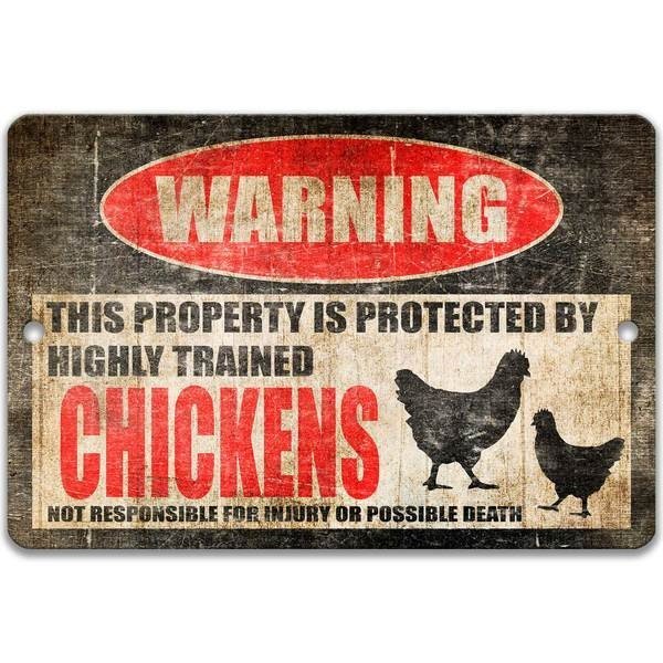 Chickens warning metal sign, hen and rooster silhouettes beside bold red WARNING lettering, 'not responsible for injury or possible death'