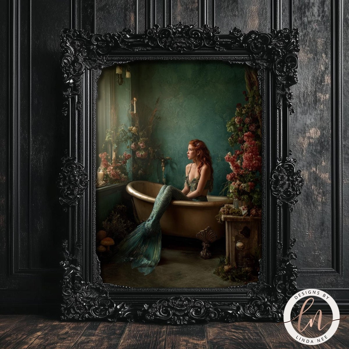 A mermaid with red hair is sitting in a bathtub, surrounded by flowers and plants, in an ornate black frame.