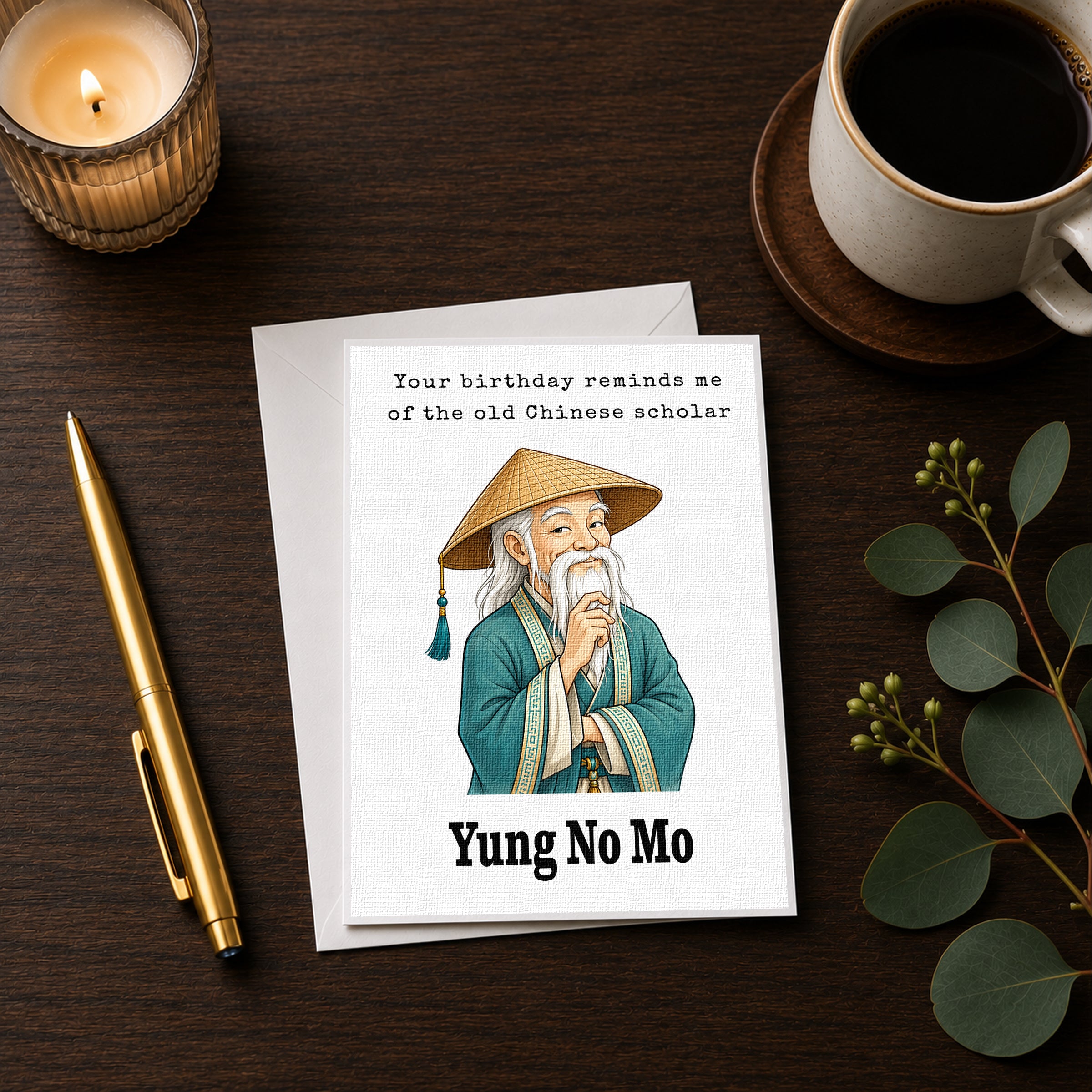 a birthday card with an illustration of an elderly man wearing a conical hat, sitting on a wooden surface next to a cup of coffee and a pen.