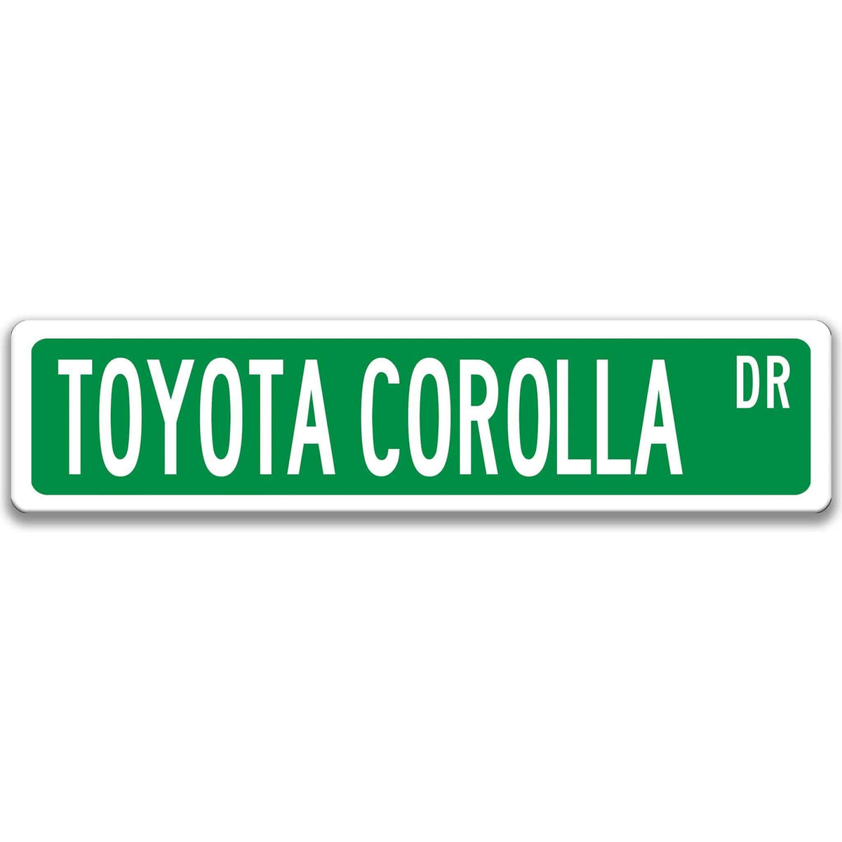 Green Toyota Corolla street sign with white border and white text reading TOYOTA COROLLA DR