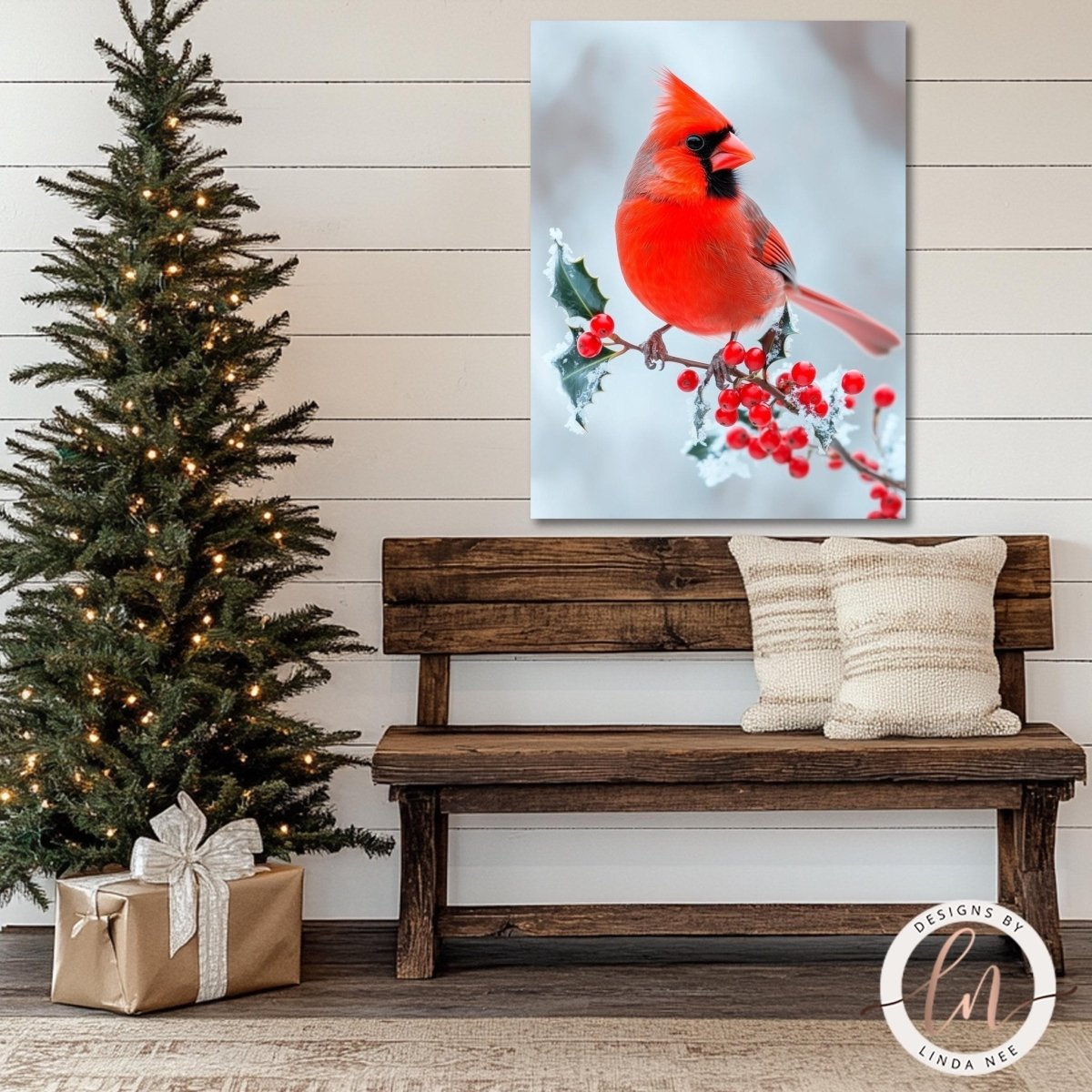 Cardinal painting displayed above a wooden bench beside a lit Christmas tree