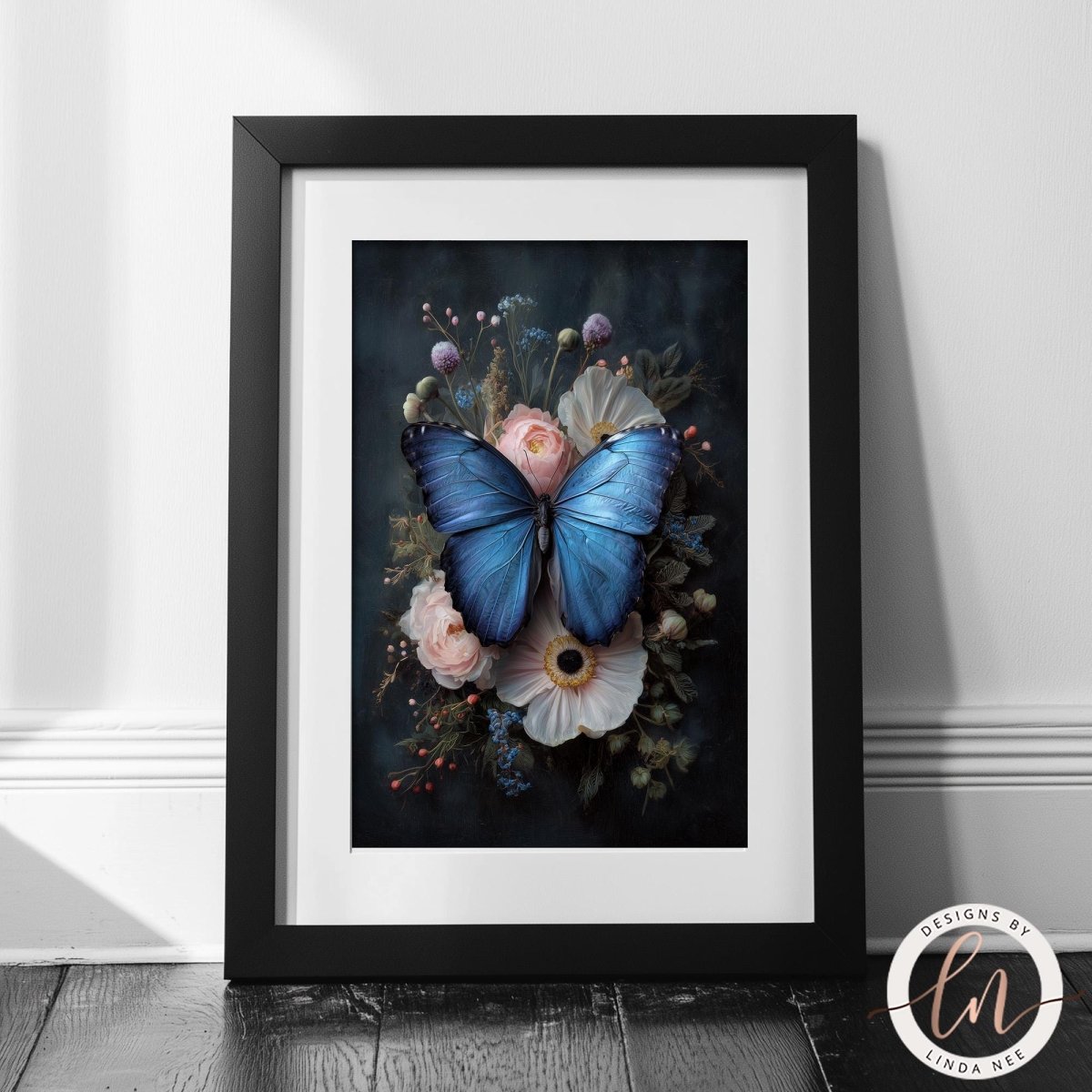 A framed print of a blue butterfly resting on a floral arrangement, with a dark background and white flowers.