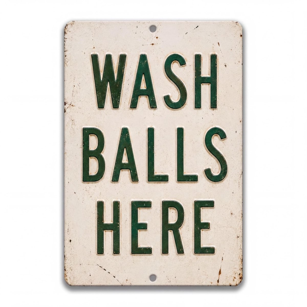 Vintage-style metal bathroom sign with distressed cream background and bold green text reading “Wash Balls Here,” shown as humorous rustic wall decor.