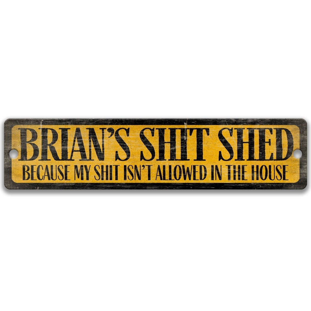 A wooden sign with the text "BRIAN'S SHIT SHED" in bold yellow letters, with the phrase "BECAUSE MY SHIT ISN'T ALLOWED IN THE HOUSE" in smaller black letters below.