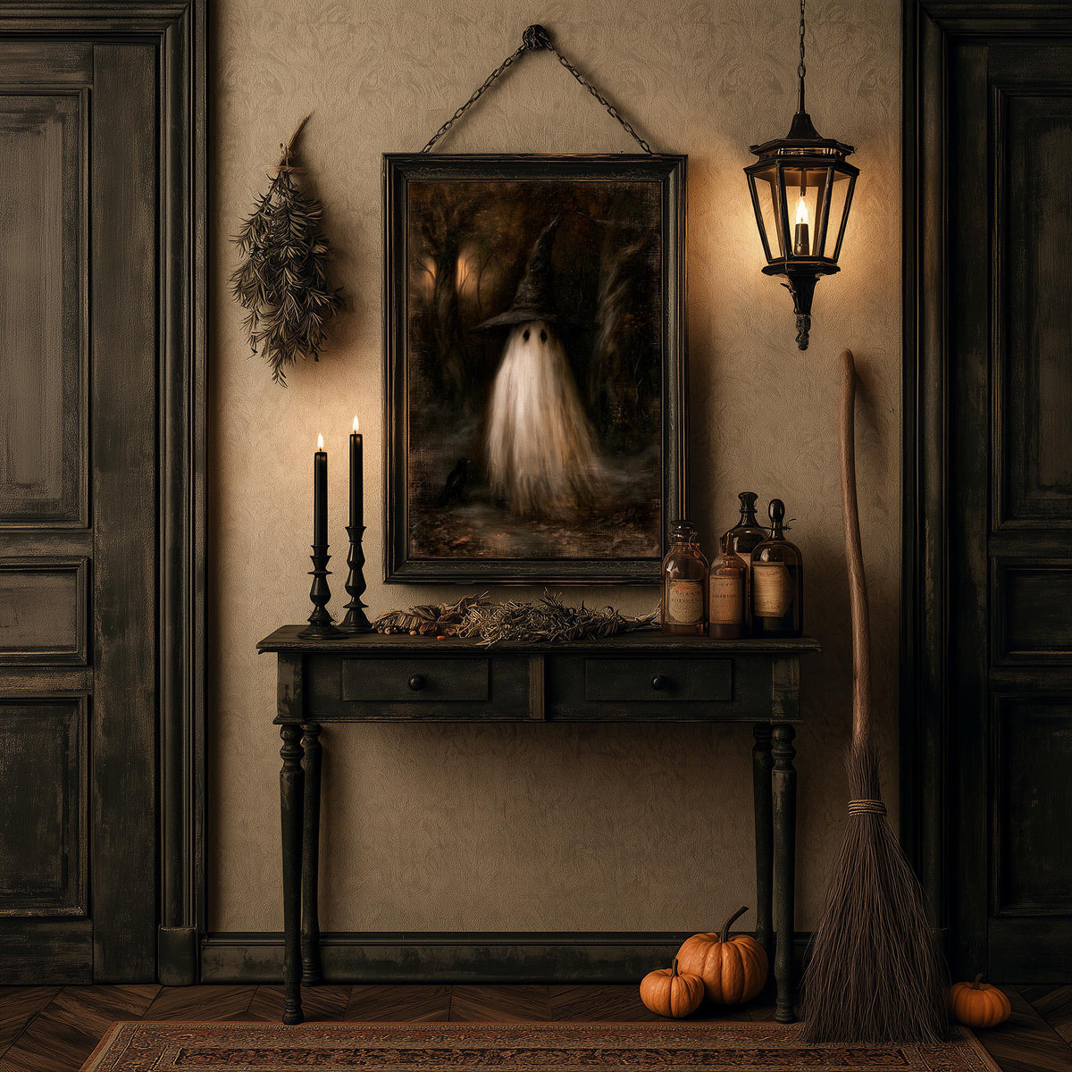 Halloween table of candles, bottles, pumpkins, and a broom below the ghost print