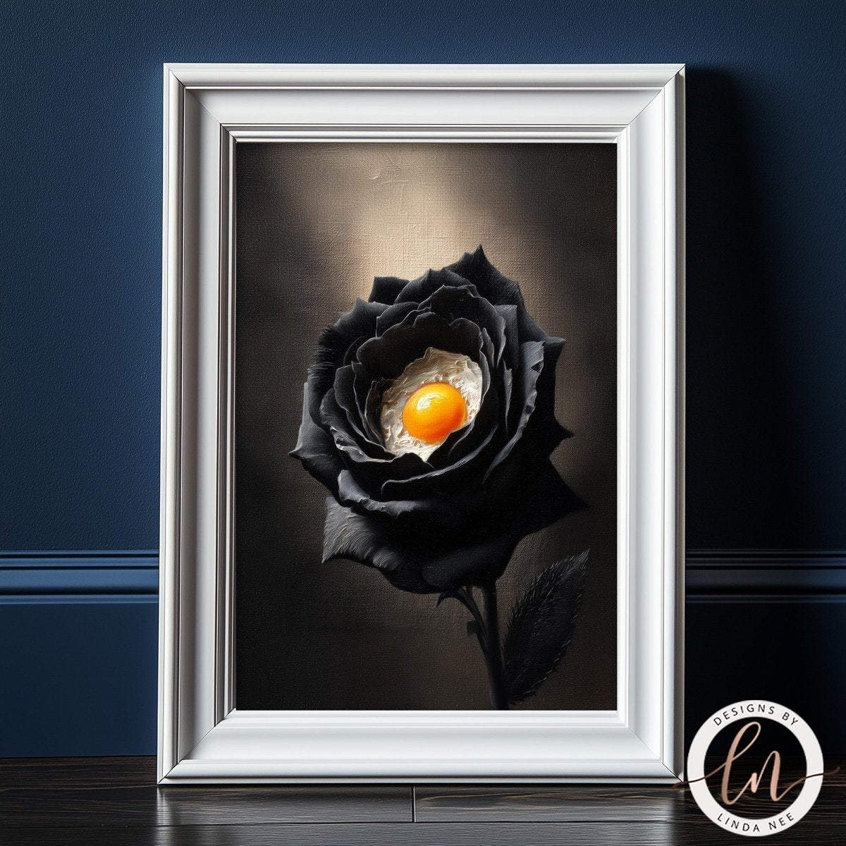 A framed image of a black rose with an orange center, set against a dark background.