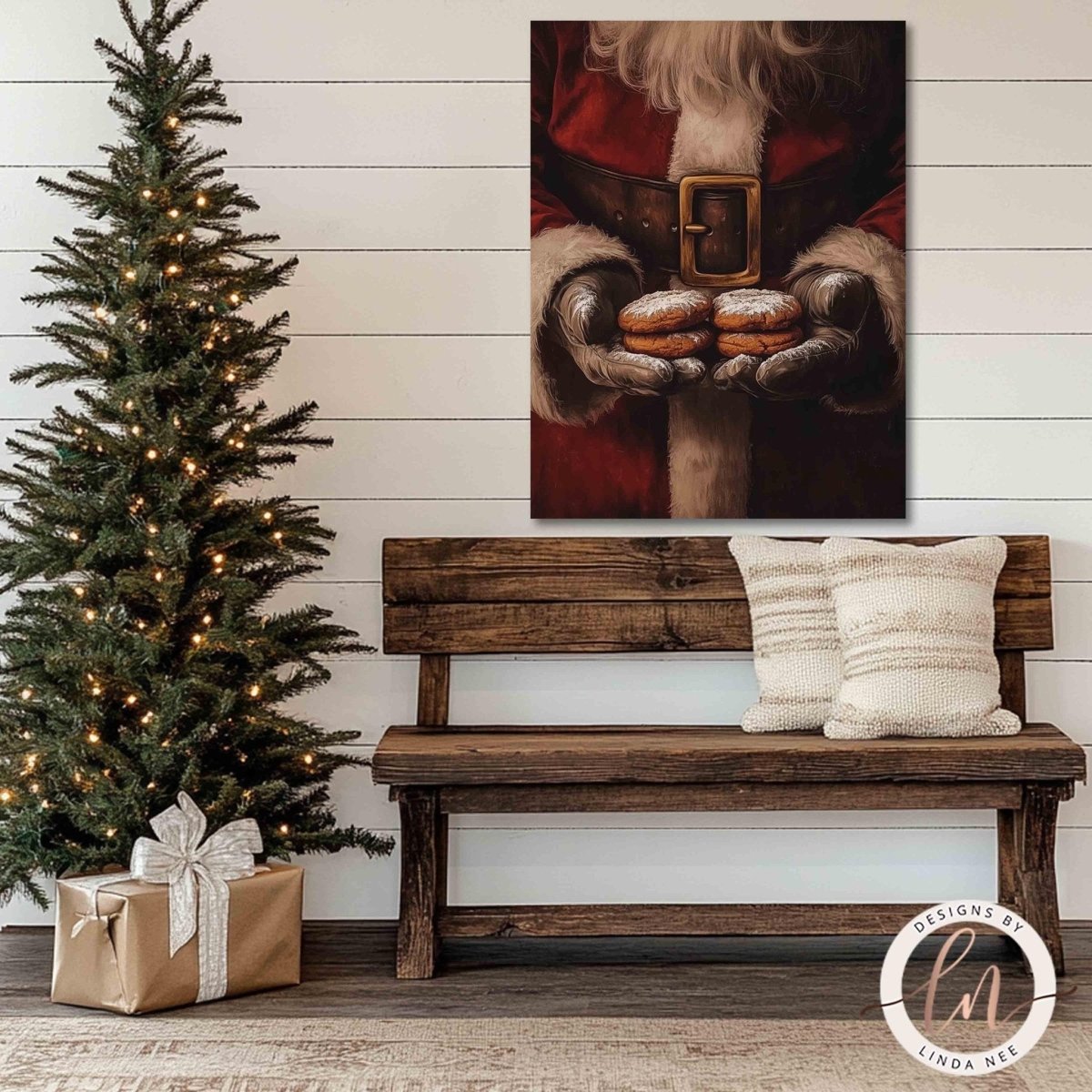 Santa holding cookies wall art shown above a wooden bench beside a tree