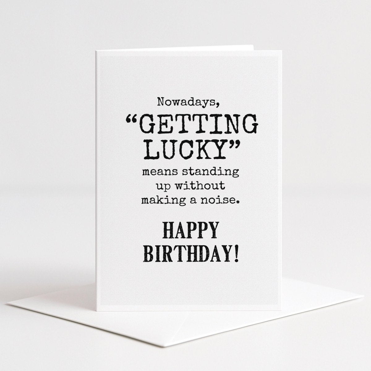 a birthday card with a humorous message about luck and standing up without making noise.