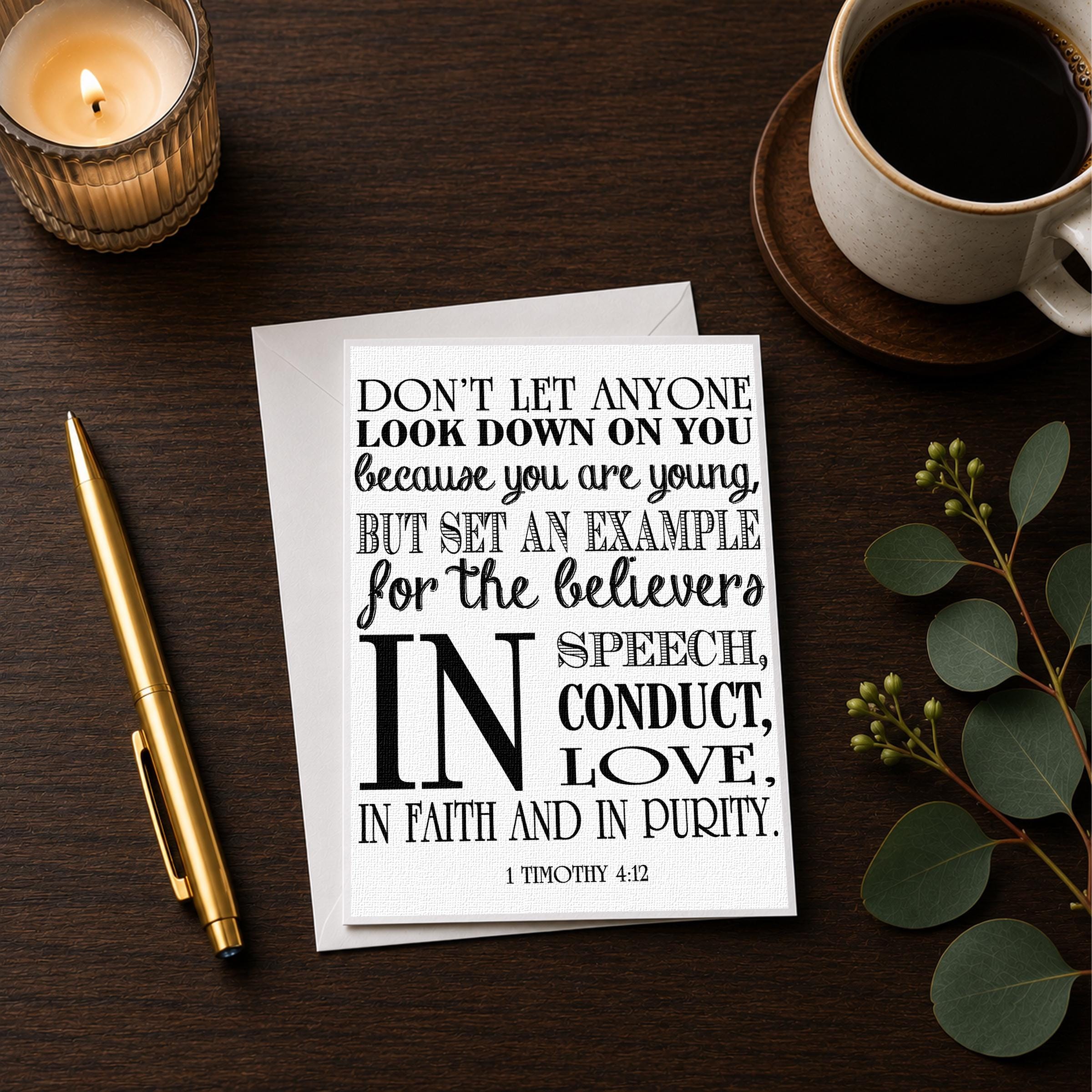 a card with a quote from the Bible, a candle, a pen, and a cup of coffee on a wooden surface.