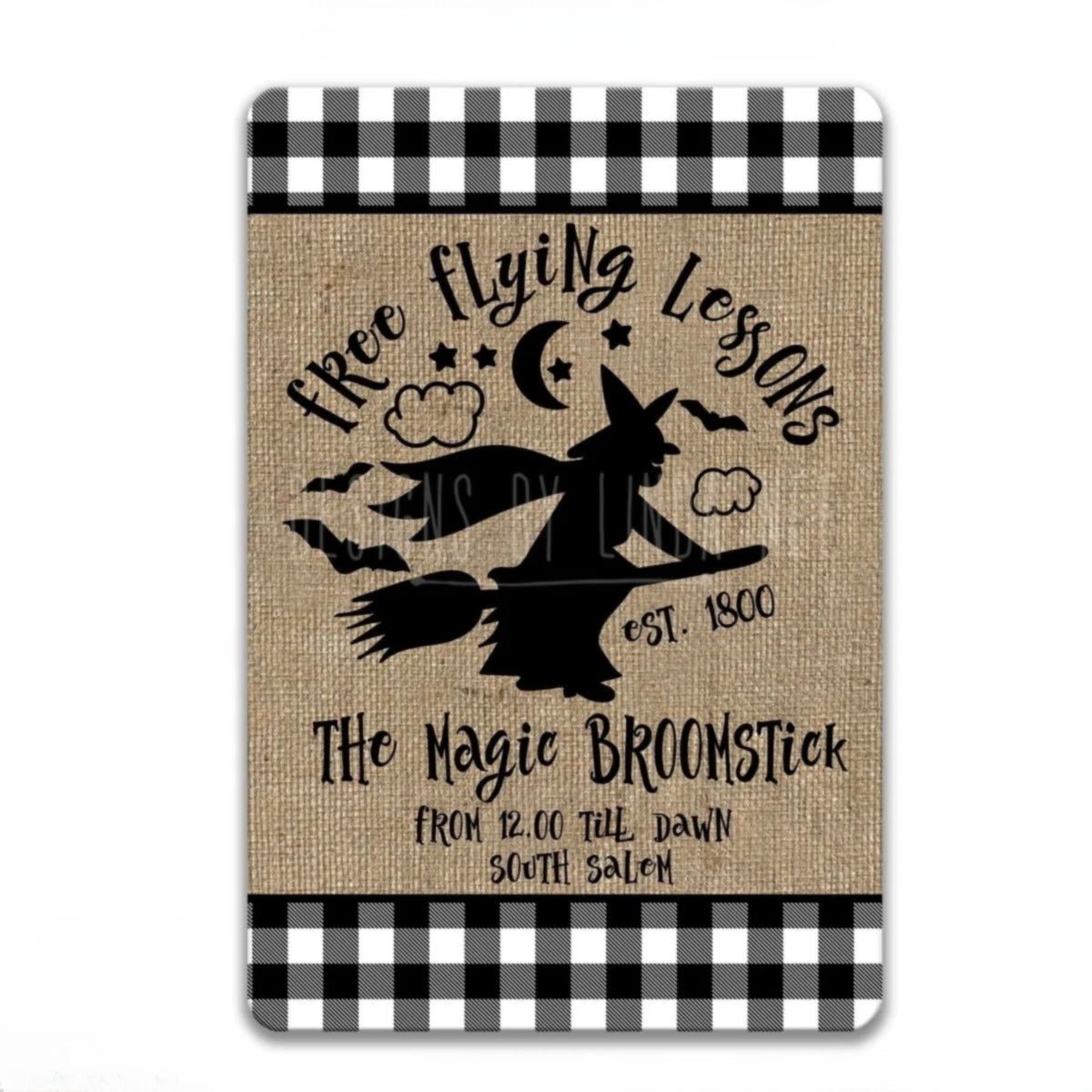The image is a sign for "The Magic Broomstick" that is "Est. 1800" and "From 12.00 till Dawn South Salem". The sign is made of burlap and has a black and white checkered border.