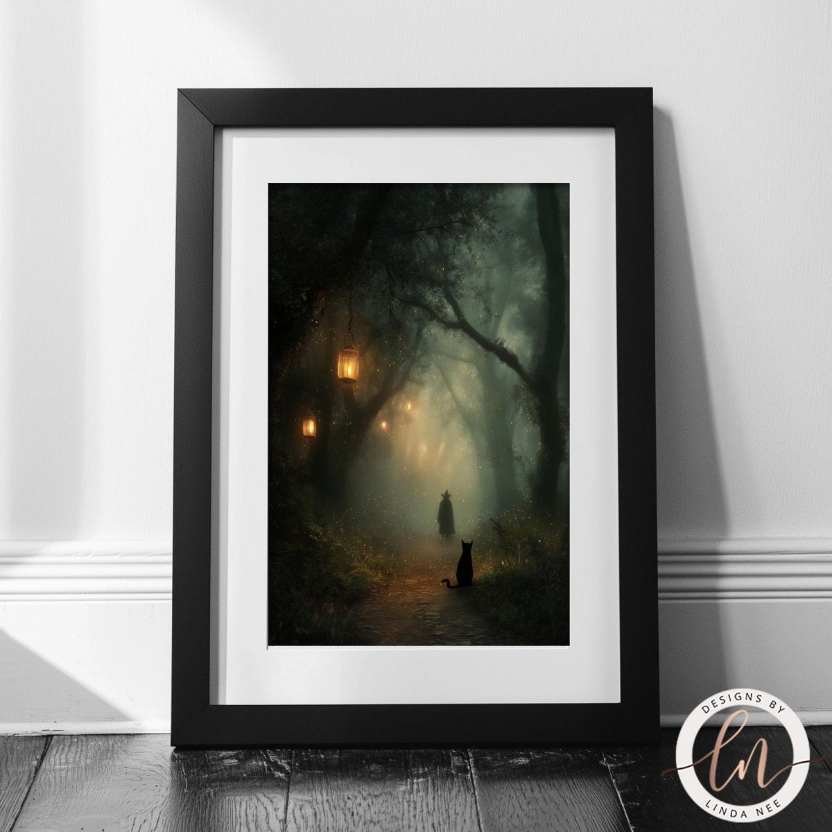 A framed painting depicting a serene forest scene with a path leading through the trees, illuminated by the soft glow of lanterns hanging from the branches.