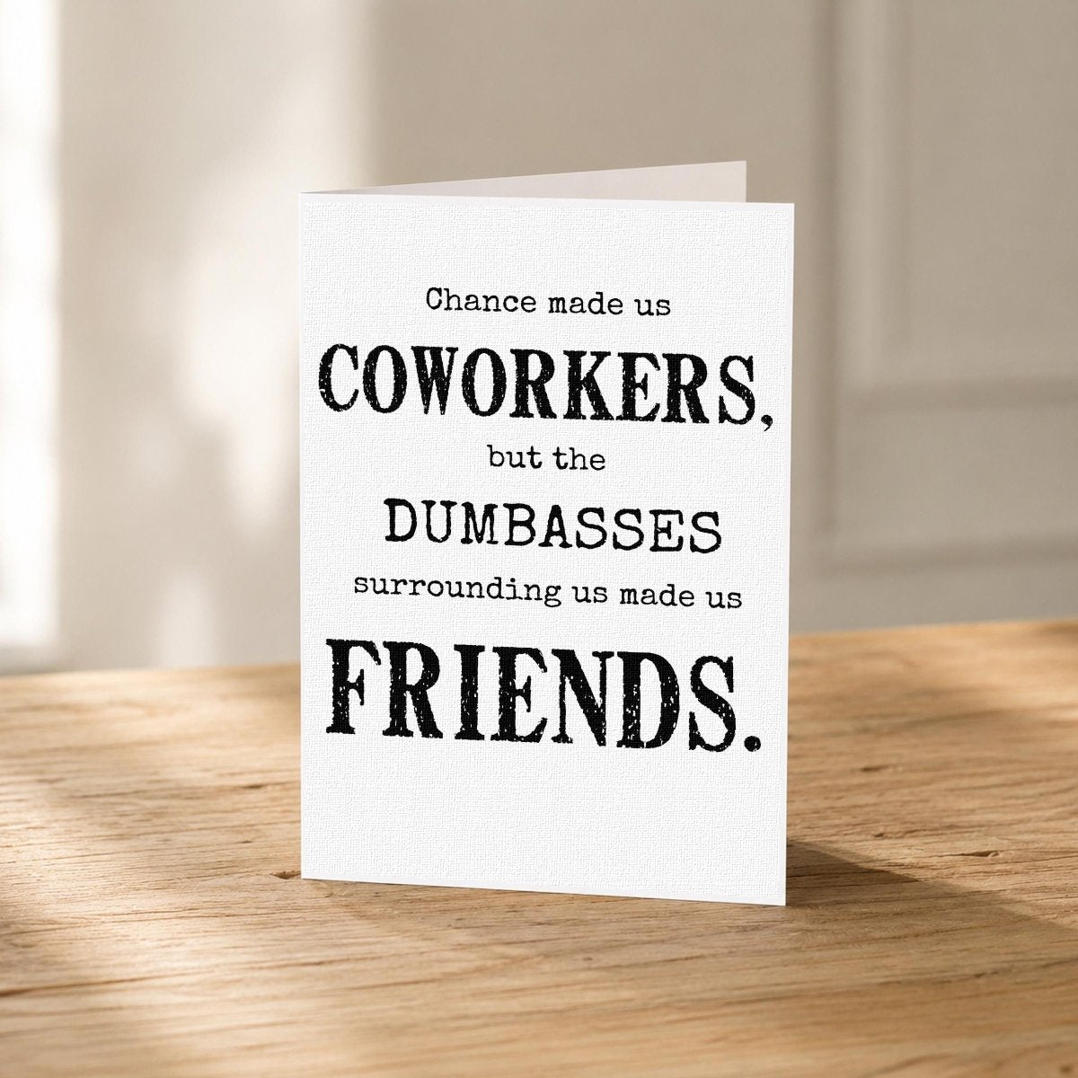 Close-up of the Made Us Friends Funny Coworker Card showing the bold distressed typography.