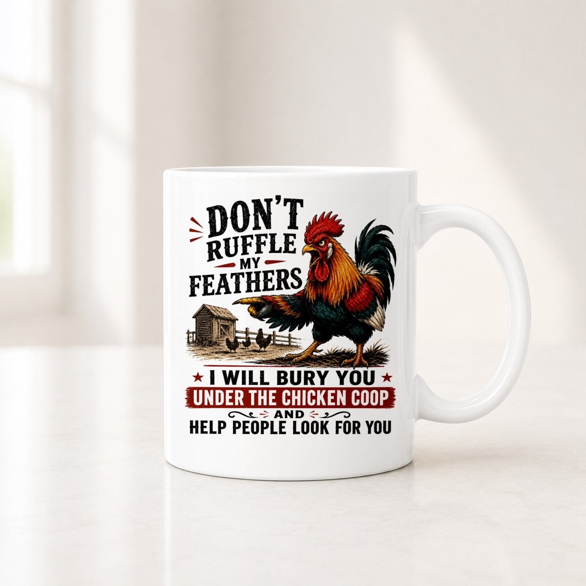 Second view of the white rooster mug with the line I Will Bury You Under the Chicken Coop on a red banner