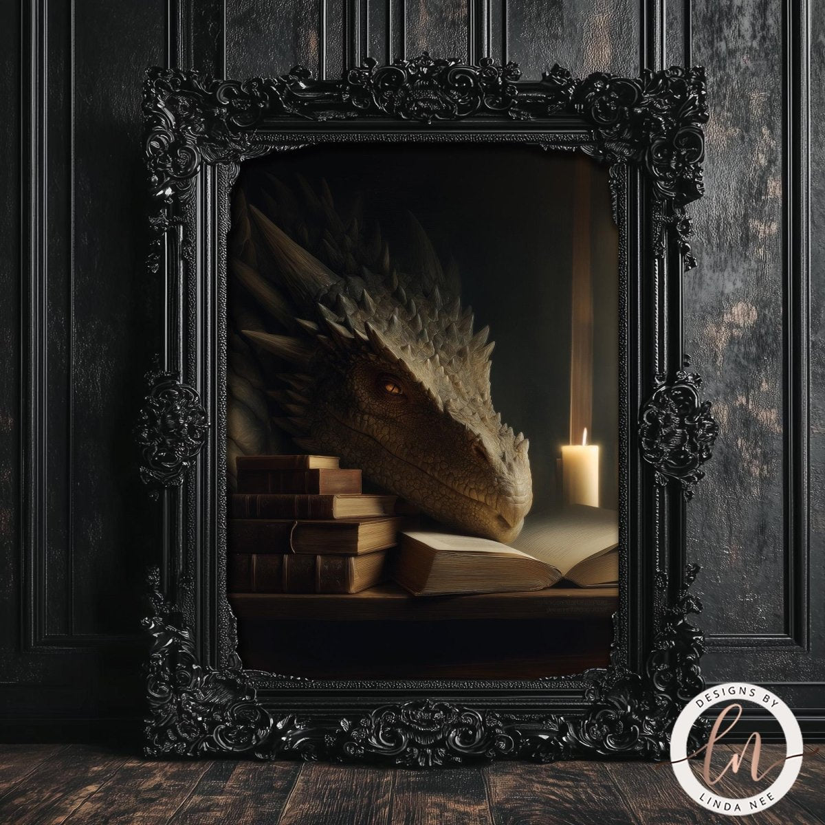 A dragon-like creature with sharp teeth and claws is perched on a stack of books, with a lit candle casting a warm glow on the scene. The image is framed in an ornate black frame and is displayed on a dark wooden surface.