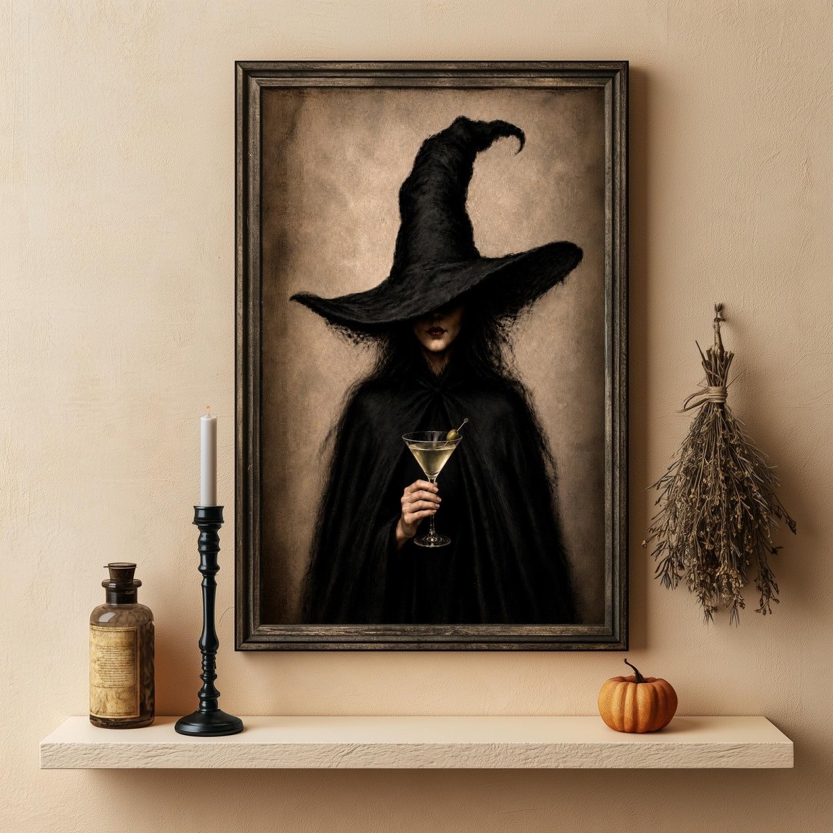 Dark academia print above a shelf holding a candle, a bottle, and a small pumpkin